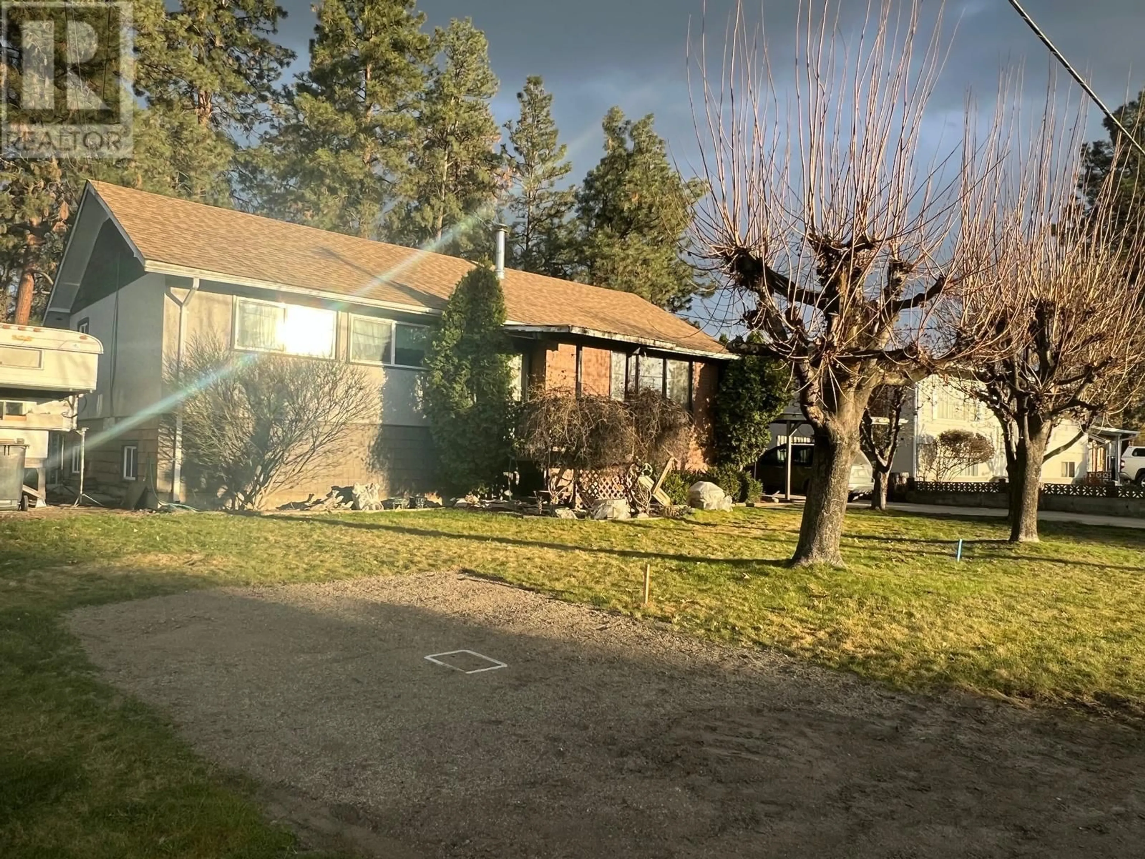 A pic from outside/outdoor area/front of a property/back of a property/a pic from drone, unknown for 225 Cambie Road, Kelowna British Columbia V1X3H9