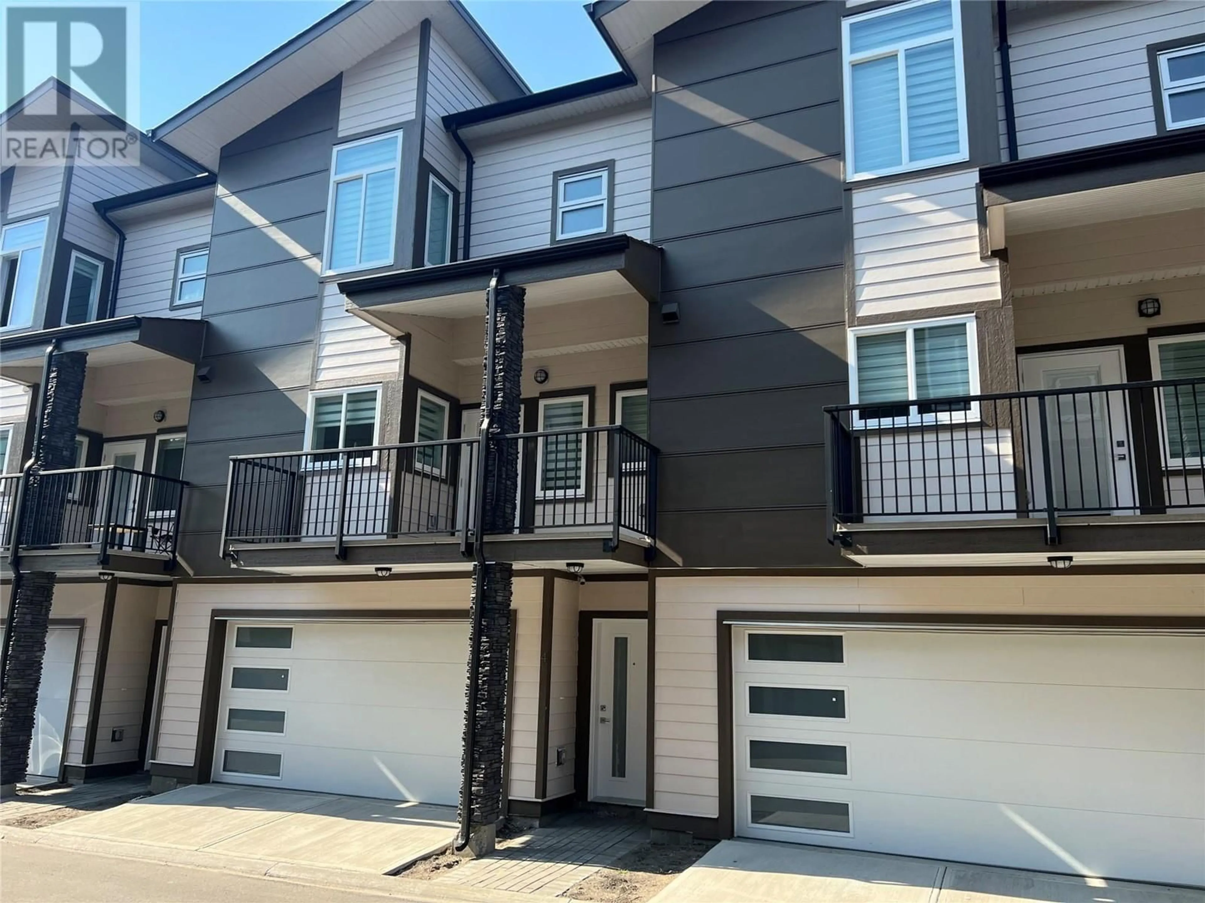 Home with vinyl exterior material, street for 4 - 1354 RUTLAND ROAD ROAD NORTH, Kelowna British Columbia V1X4Z4