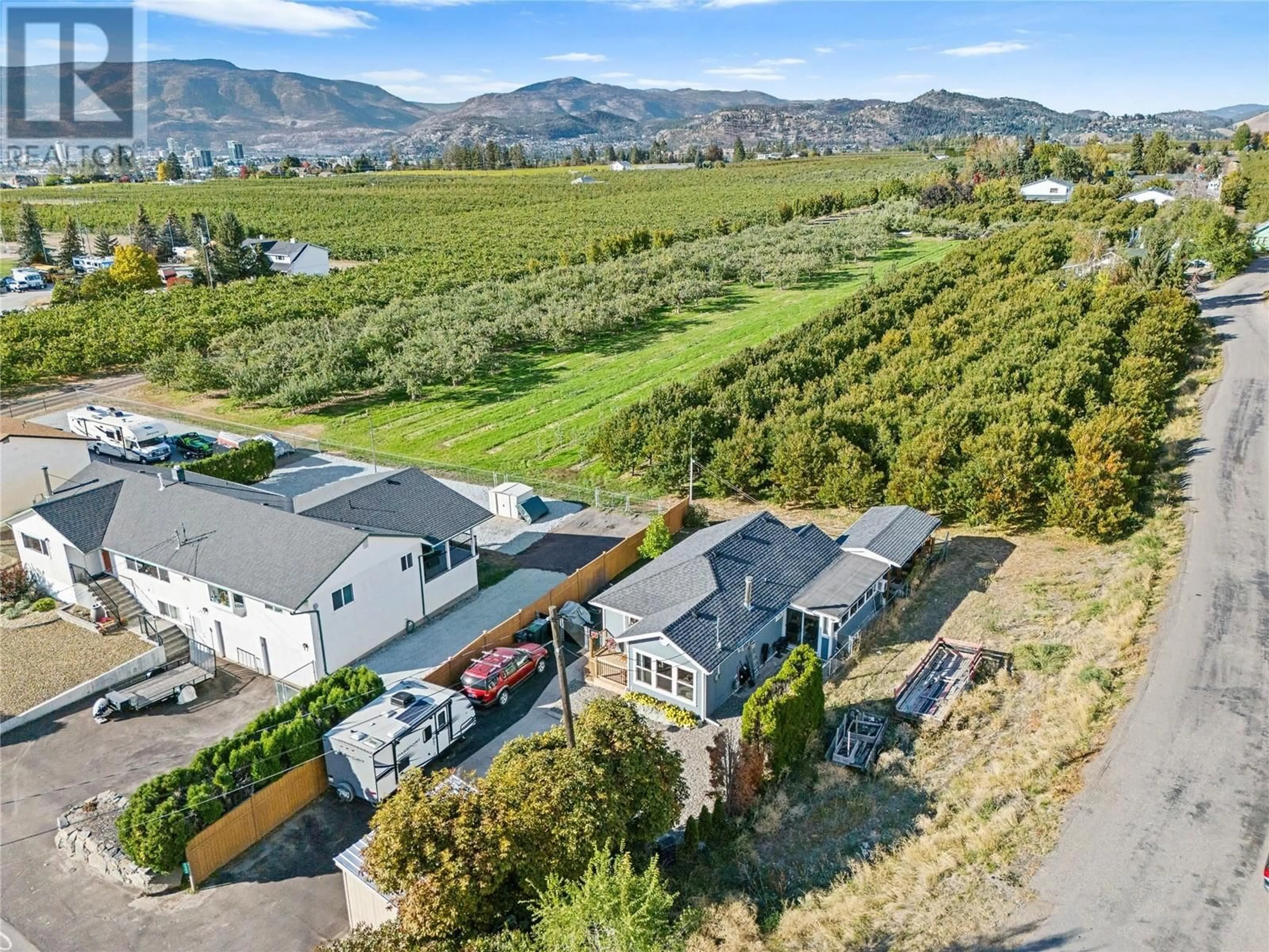 A pic from outside/outdoor area/front of a property/back of a property/a pic from drone, mountain view for 2990 McCulloch Road, Kelowna British Columbia V1W4A5