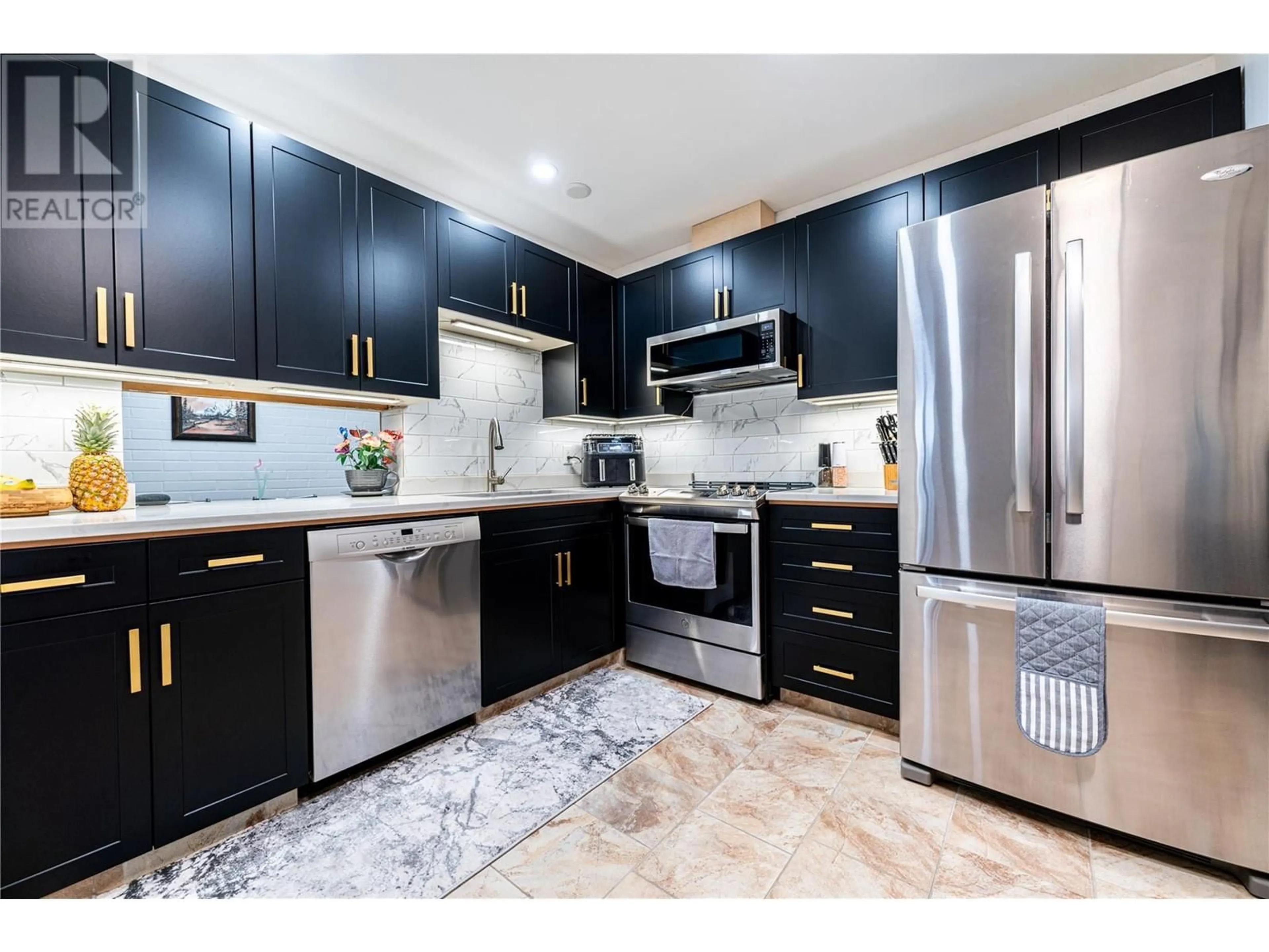 Contemporary kitchen, ceramic/tile floor for 1915 Pacific Court Unit# 406, Kelowna British Columbia V1Y8B3