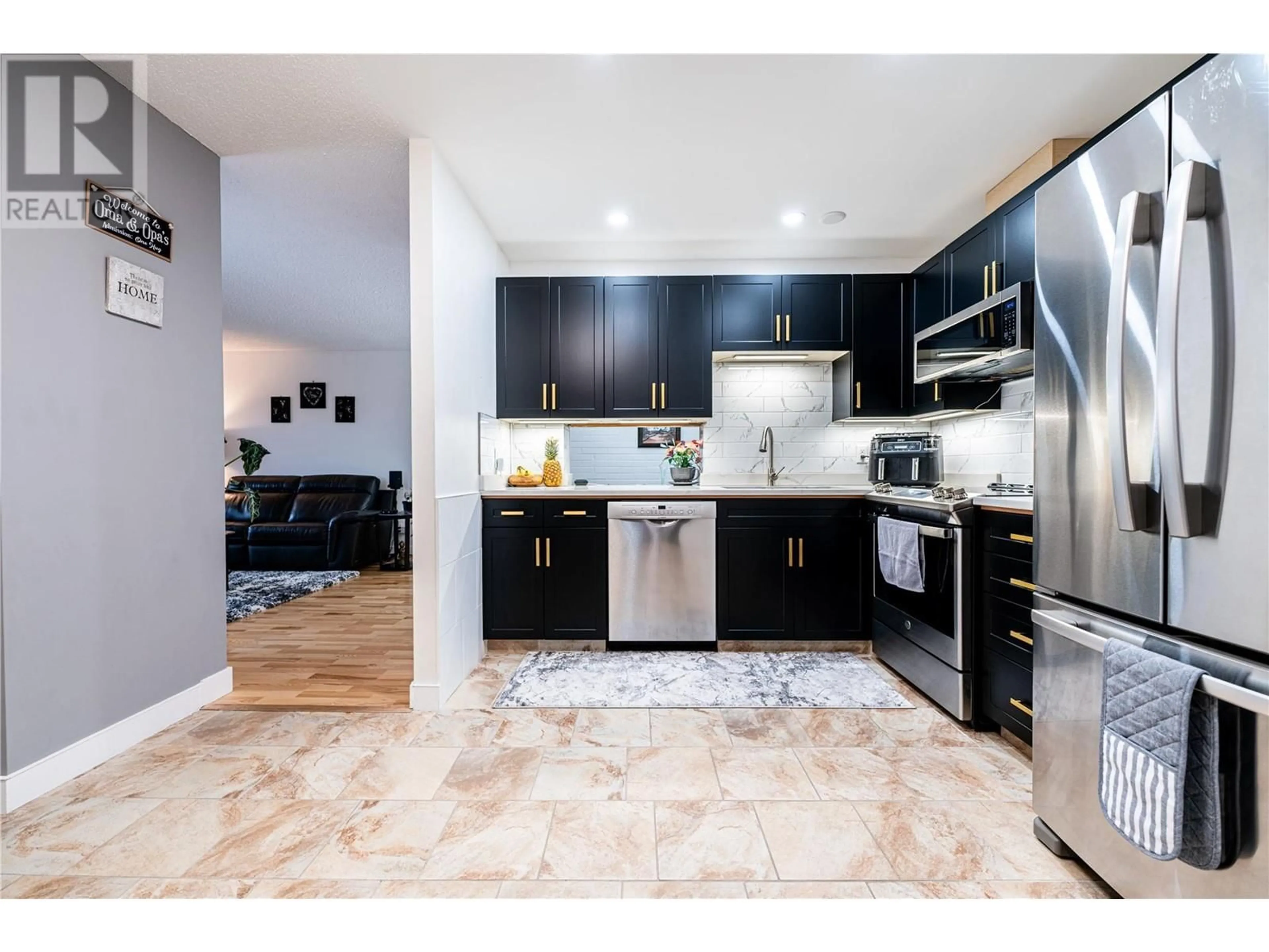 Open concept kitchen, ceramic/tile floor for 1915 Pacific Court Unit# 406, Kelowna British Columbia V1Y8B3