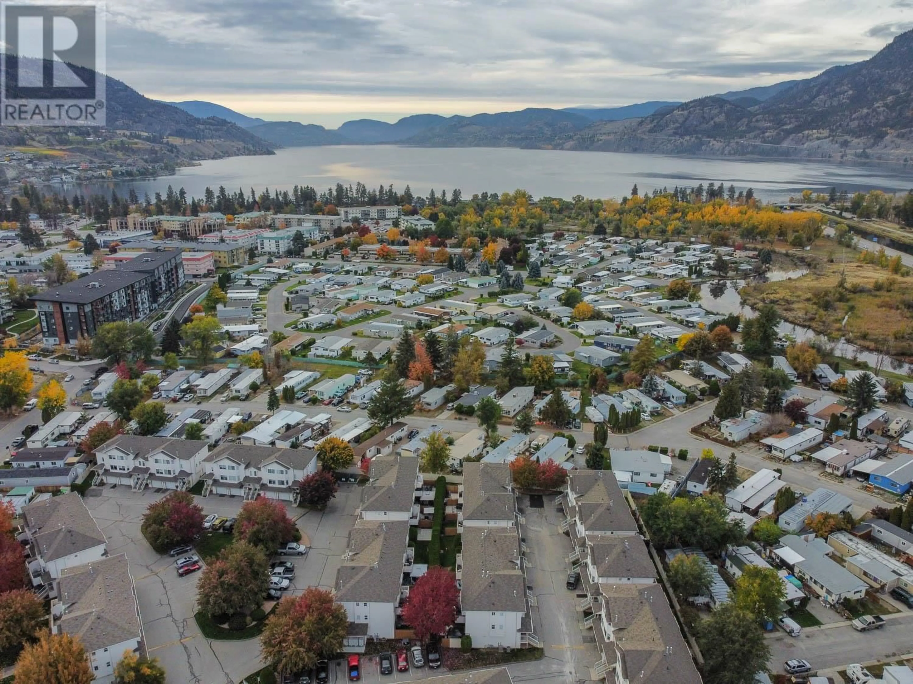 A pic from outside/outdoor area/front of a property/back of a property/a pic from drone, water/lake/river/ocean view for 3153 Paris Street Unit# 158, Penticton British Columbia V2A8P1