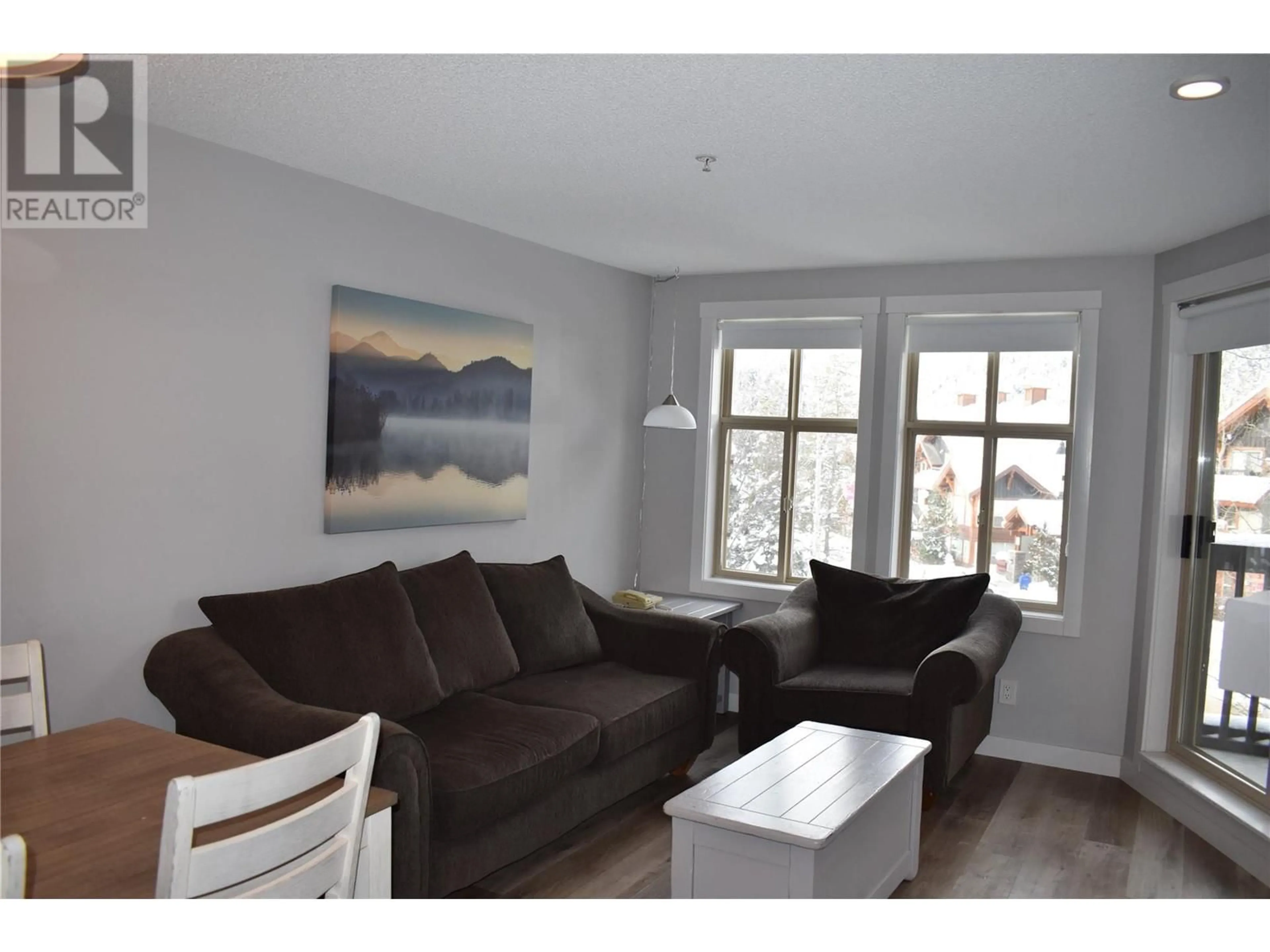 Living room with furniture, wood/laminate floor for 2060 SUMMIT Drive Unit# 214, Panorama British Columbia V0A1T0