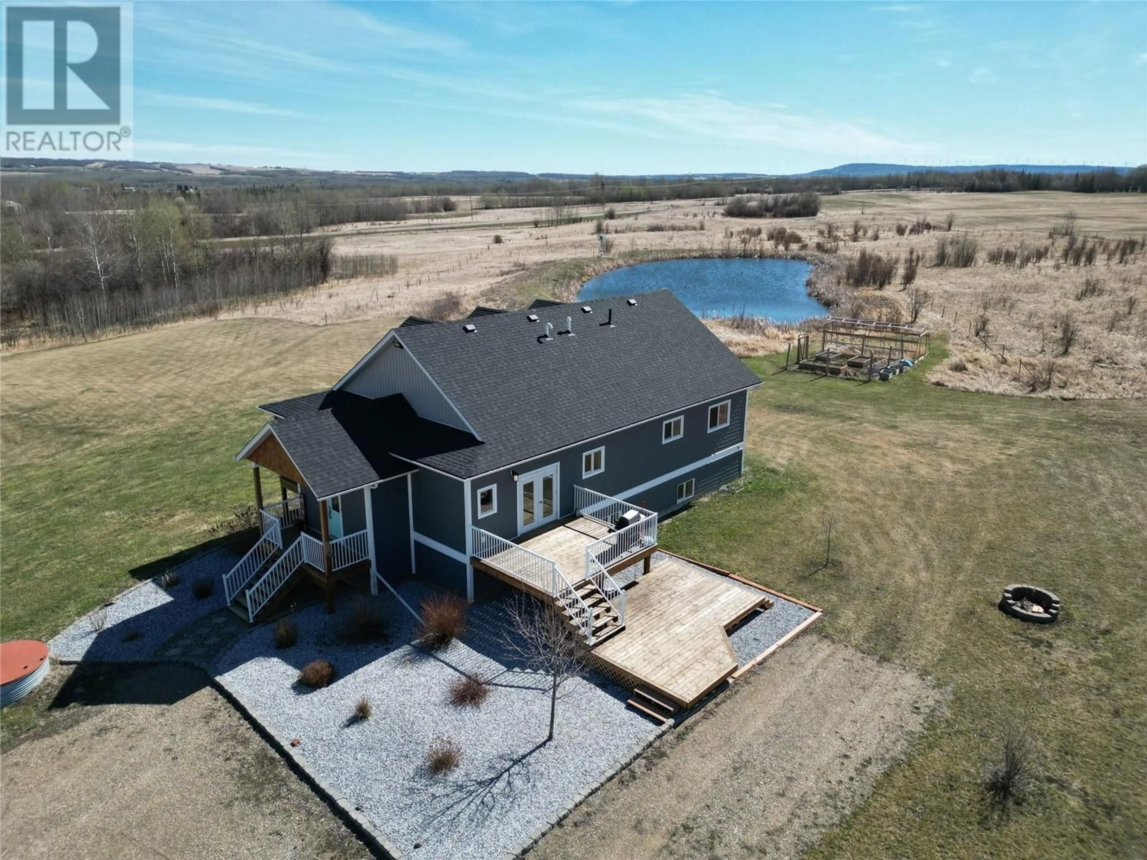 A pic from outside/outdoor area/front of a property/back of a property/a pic from drone, water/lake/river/ocean view for 5543 97 Highway, Dawson Creek British Columbia V0C1B0