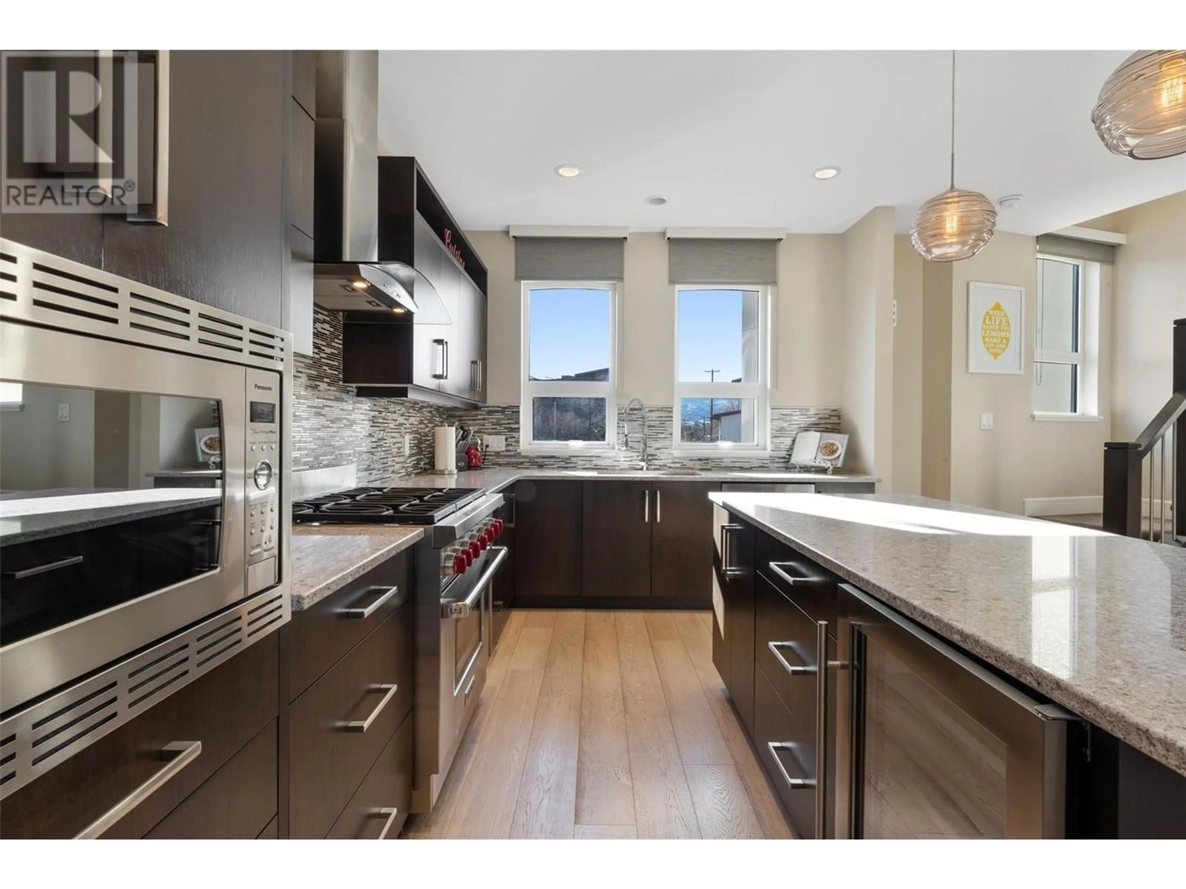 Contemporary kitchen, wood/laminate floor for 18 - 3756 LAKESHORE ROAD, Kelowna British Columbia V1W3L4