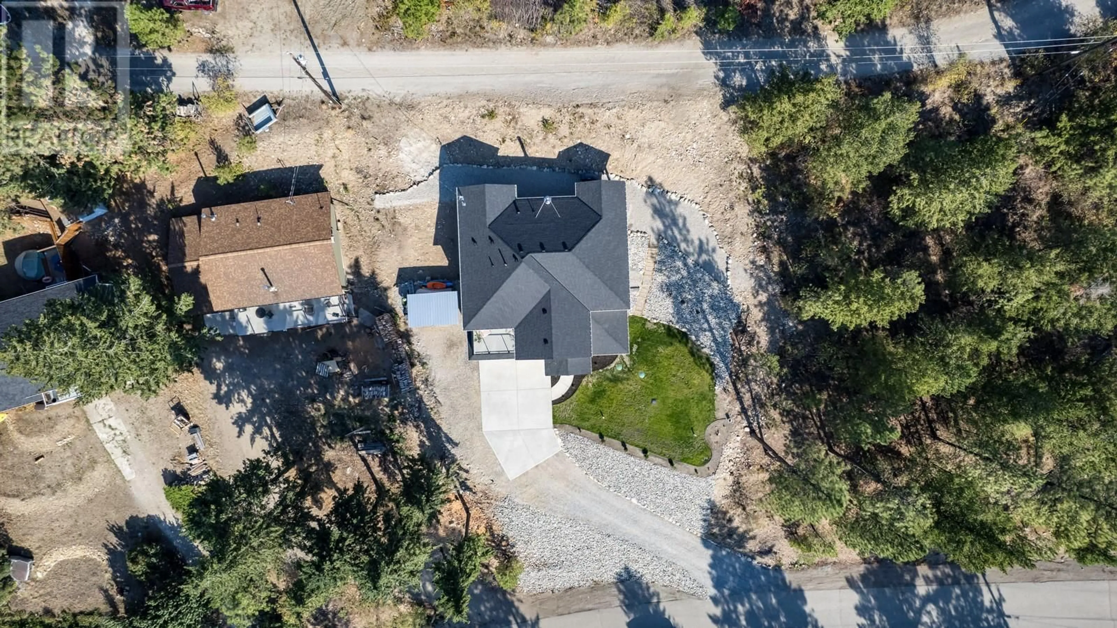 A pic from outside/outdoor area/front of a property/back of a property/a pic from drone, street for 10290 COLUMBIA Way, Vernon British Columbia V1H2B6