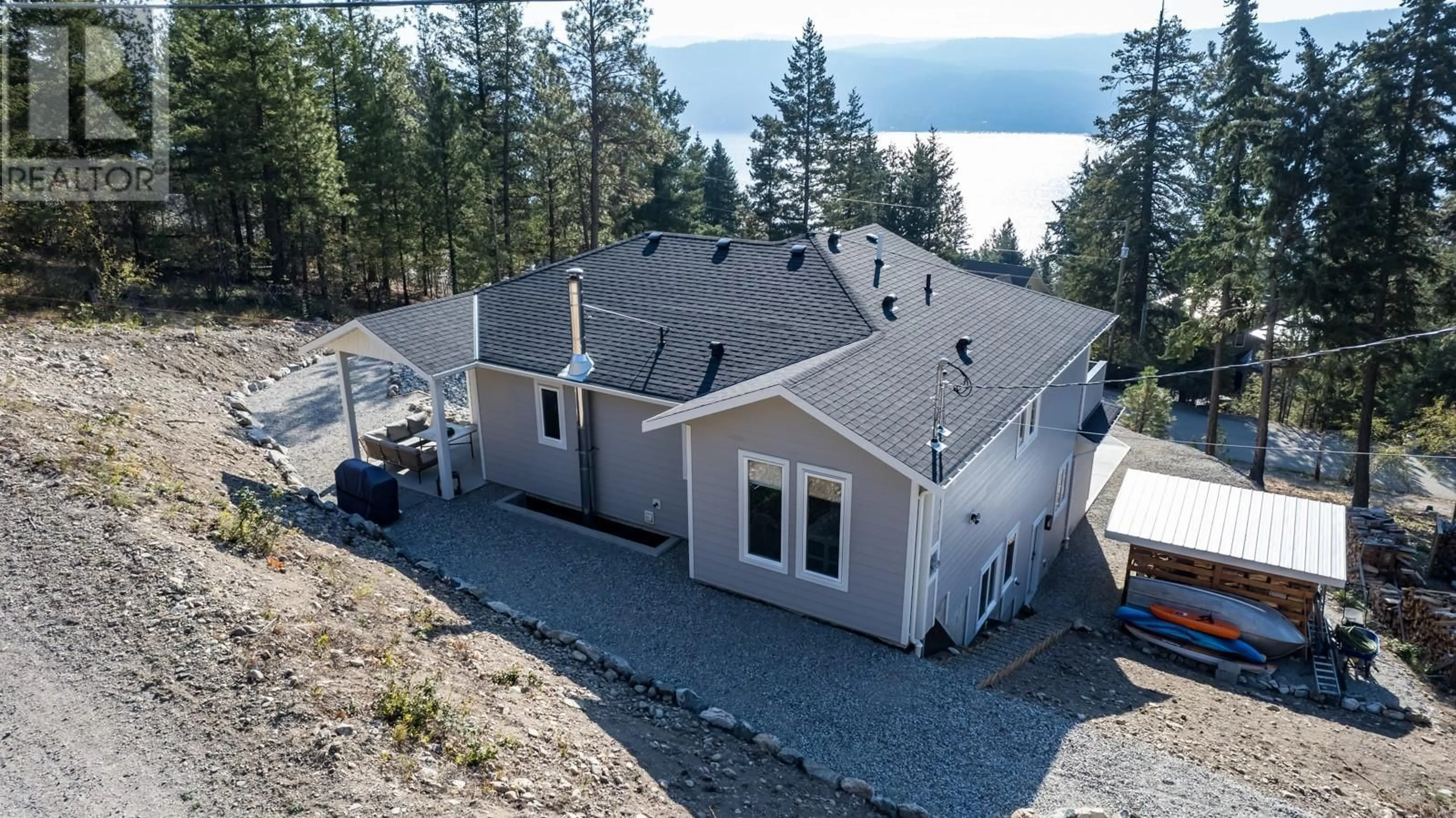 A pic from outside/outdoor area/front of a property/back of a property/a pic from drone, water/lake/river/ocean view for 10290 COLUMBIA Way, Vernon British Columbia V1H2B6