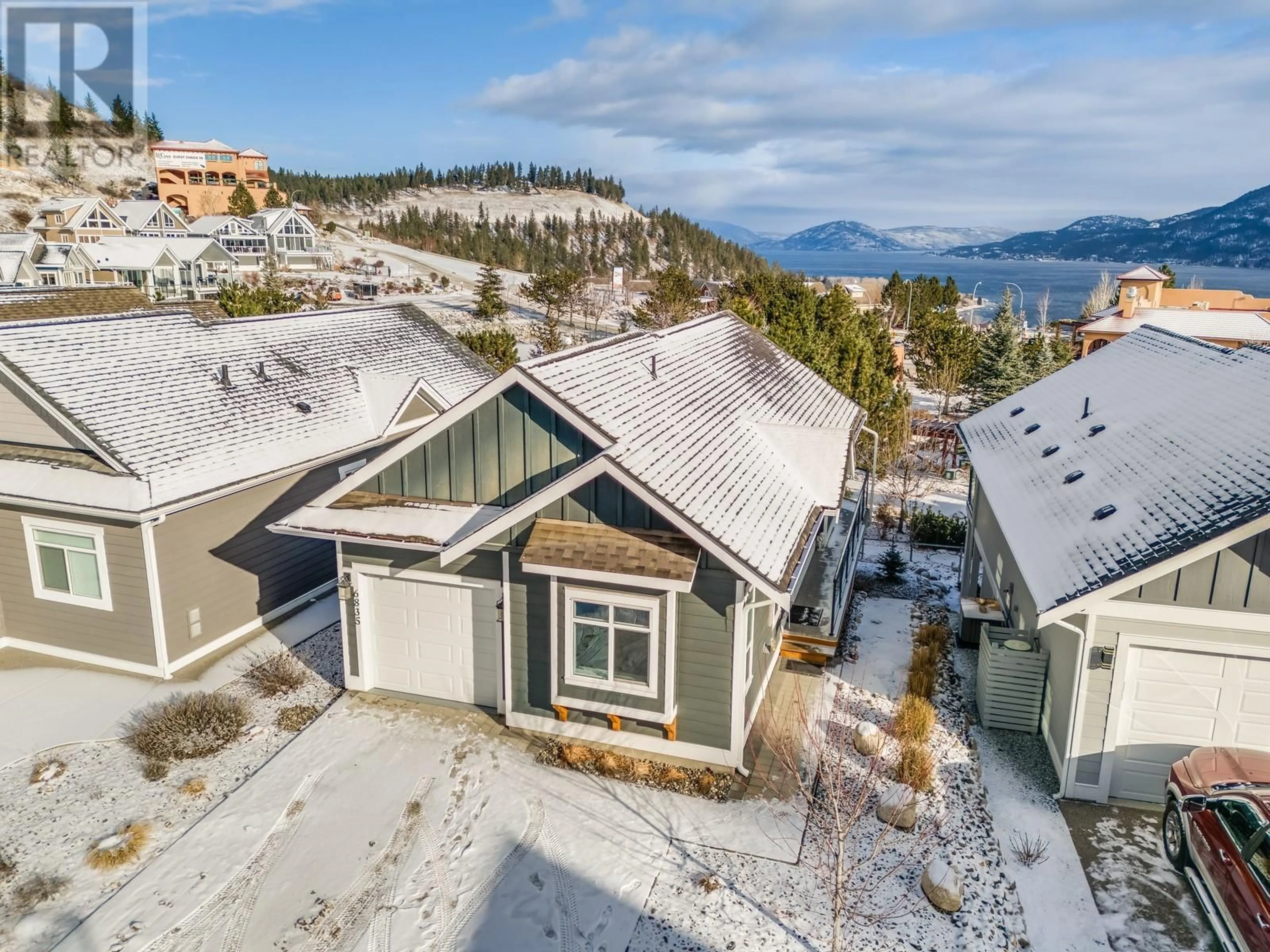 A pic from outside/outdoor area/front of a property/back of a property/a pic from drone, water/lake/river/ocean view for 6835 MADRID WAY, Kelowna British Columbia V1Z3R8