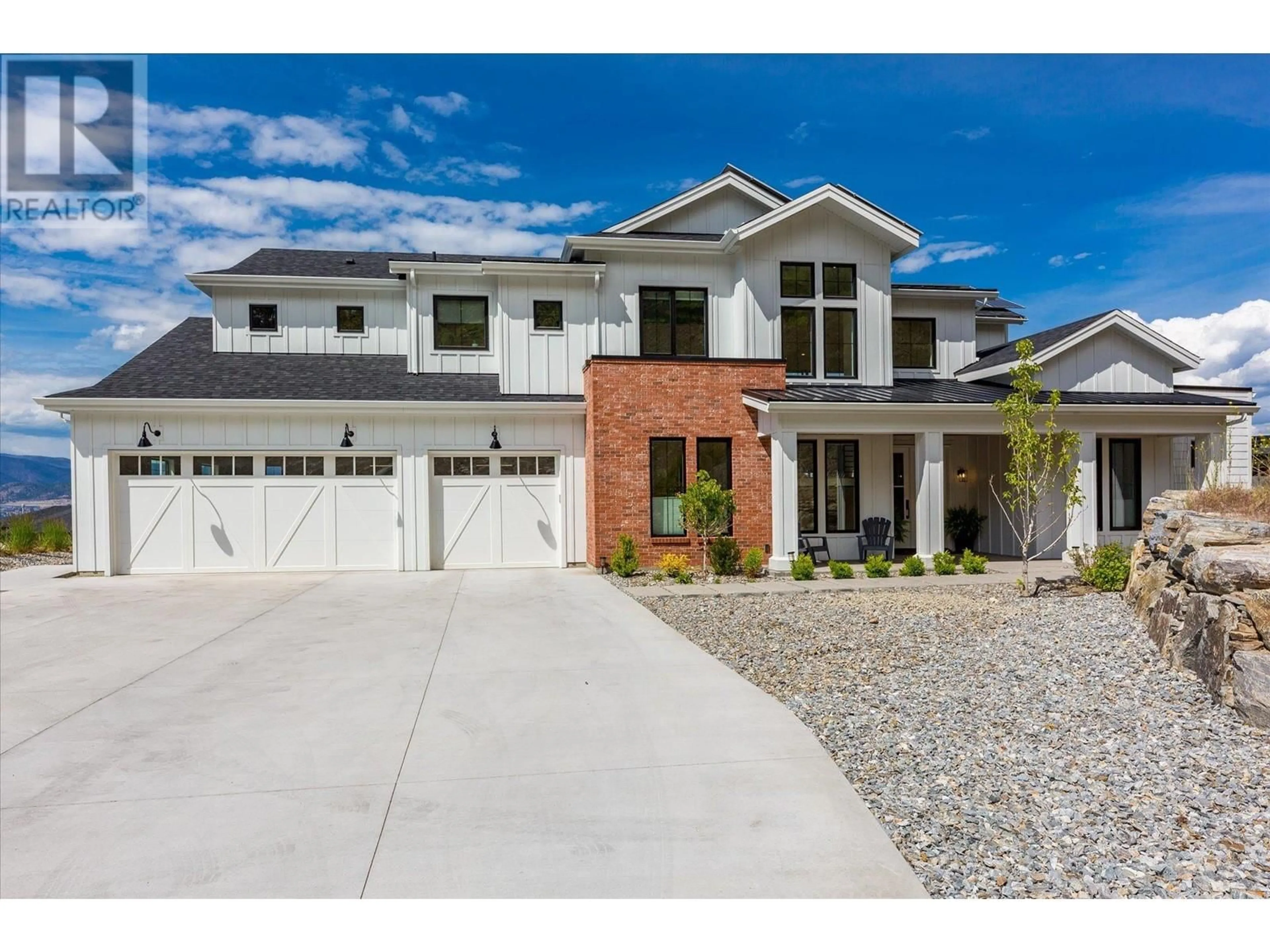 Home with brick exterior material, street for 5711 Jasper Way, Kelowna British Columbia V1W4L5