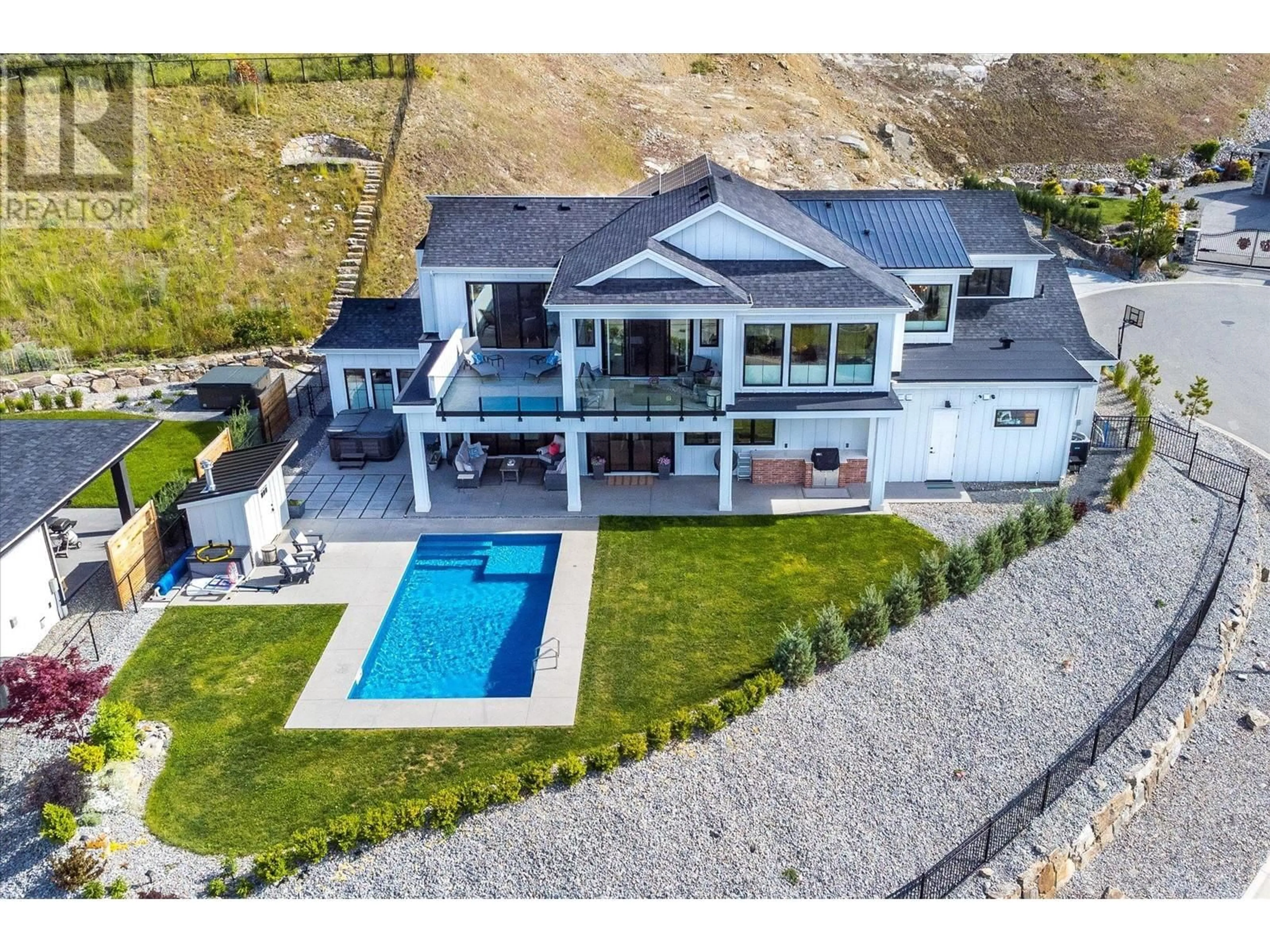 A pic from outside/outdoor area/front of a property/back of a property/a pic from drone, water/lake/river/ocean view for 5711 Jasper Way, Kelowna British Columbia V1W4L5