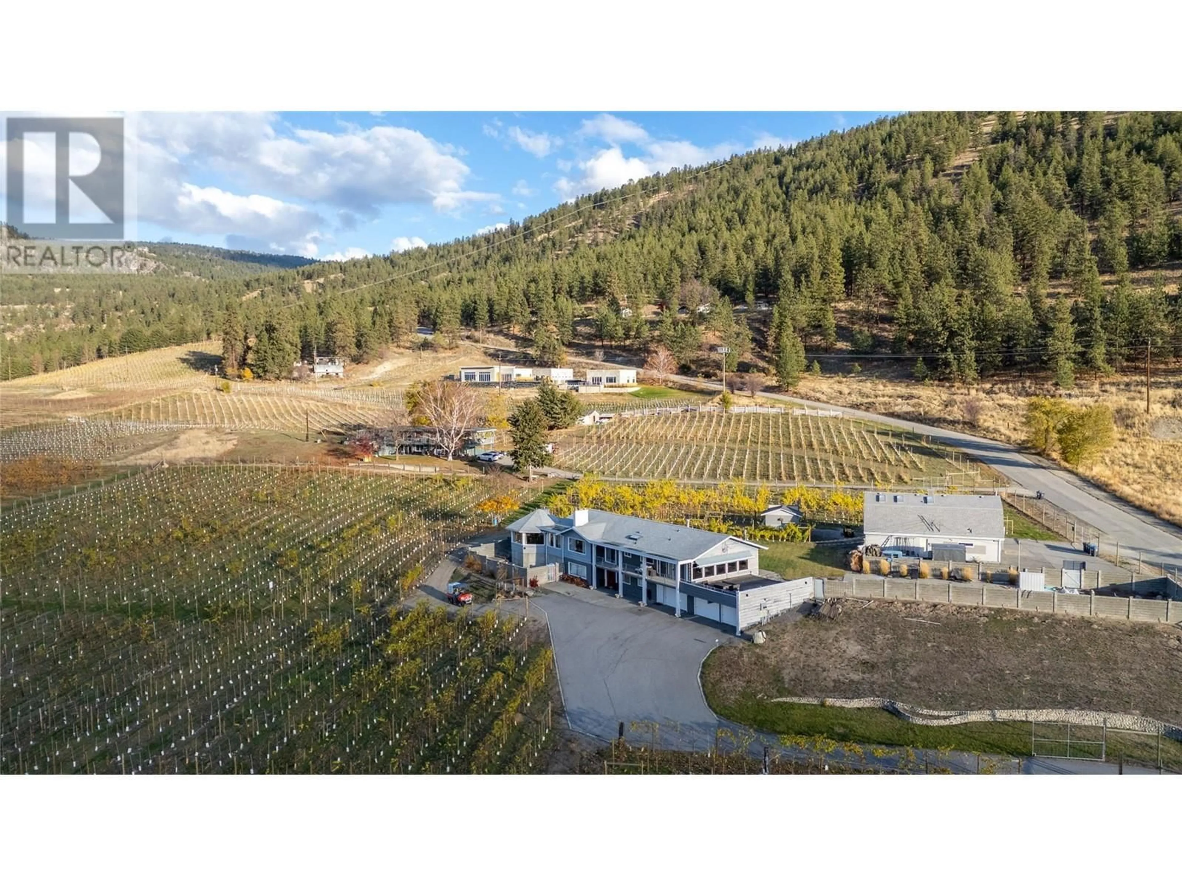 A pic from outside/outdoor area/front of a property/back of a property/a pic from drone, mountain view for 510 Naramata Road, Penticton British Columbia V2A8T3