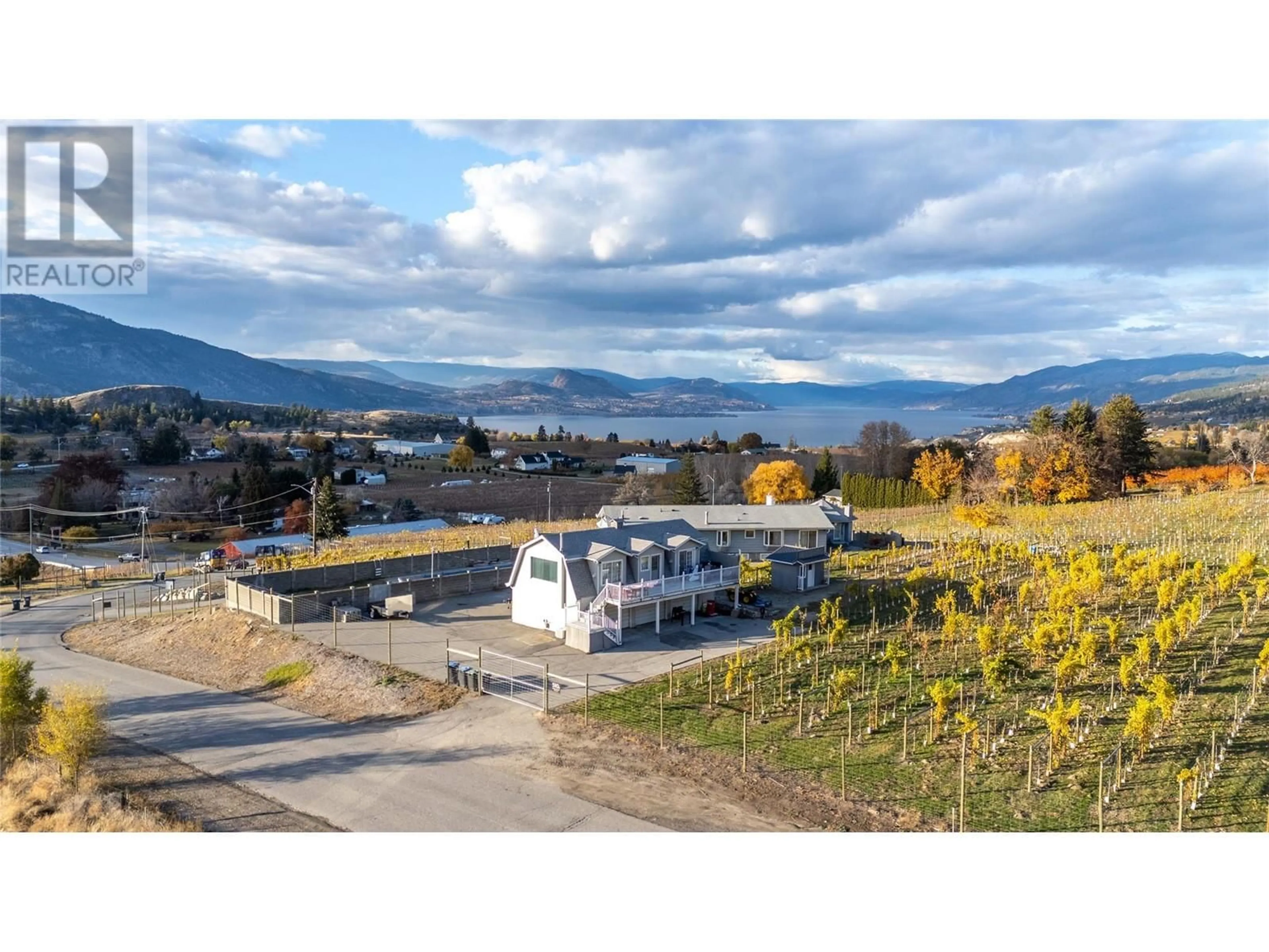 A pic from outside/outdoor area/front of a property/back of a property/a pic from drone, mountain view for 510 Naramata Road, Penticton British Columbia V2A8T3