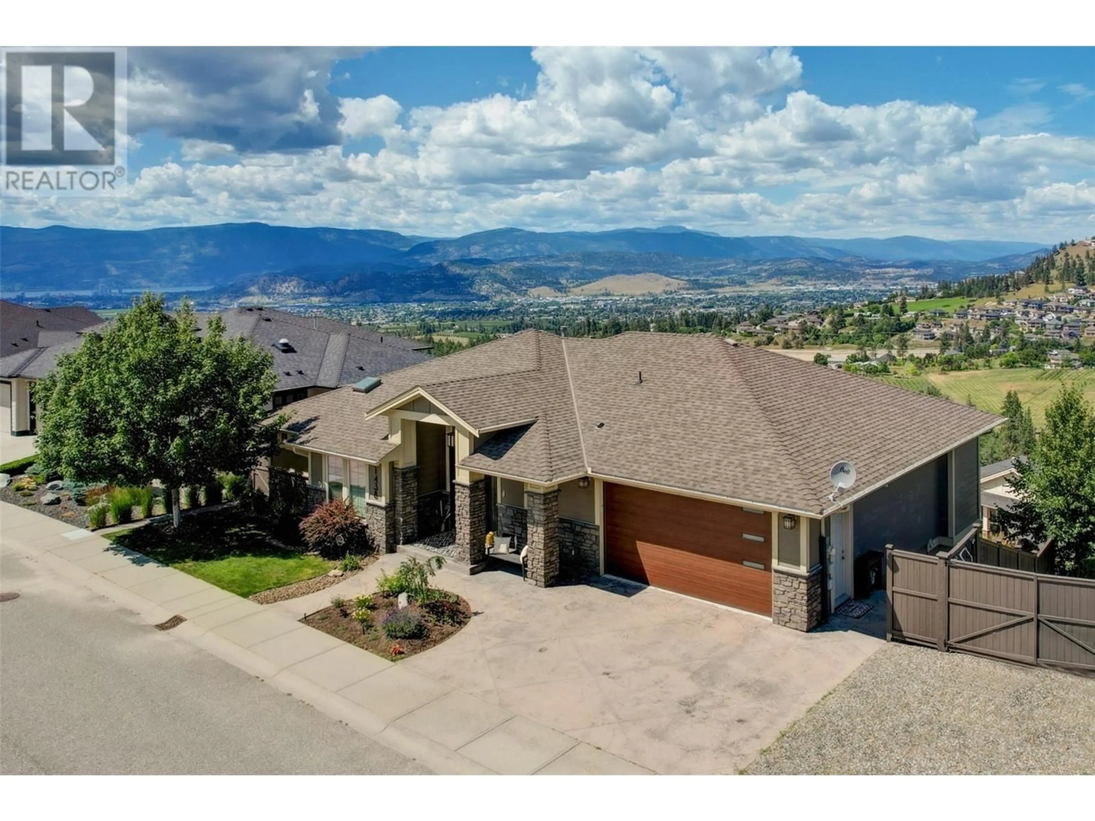 A pic from outside/outdoor area/front of a property/back of a property/a pic from drone, mountain view for 1438 MONTENEGRO DRIVE, Kelowna British Columbia V1P1R3