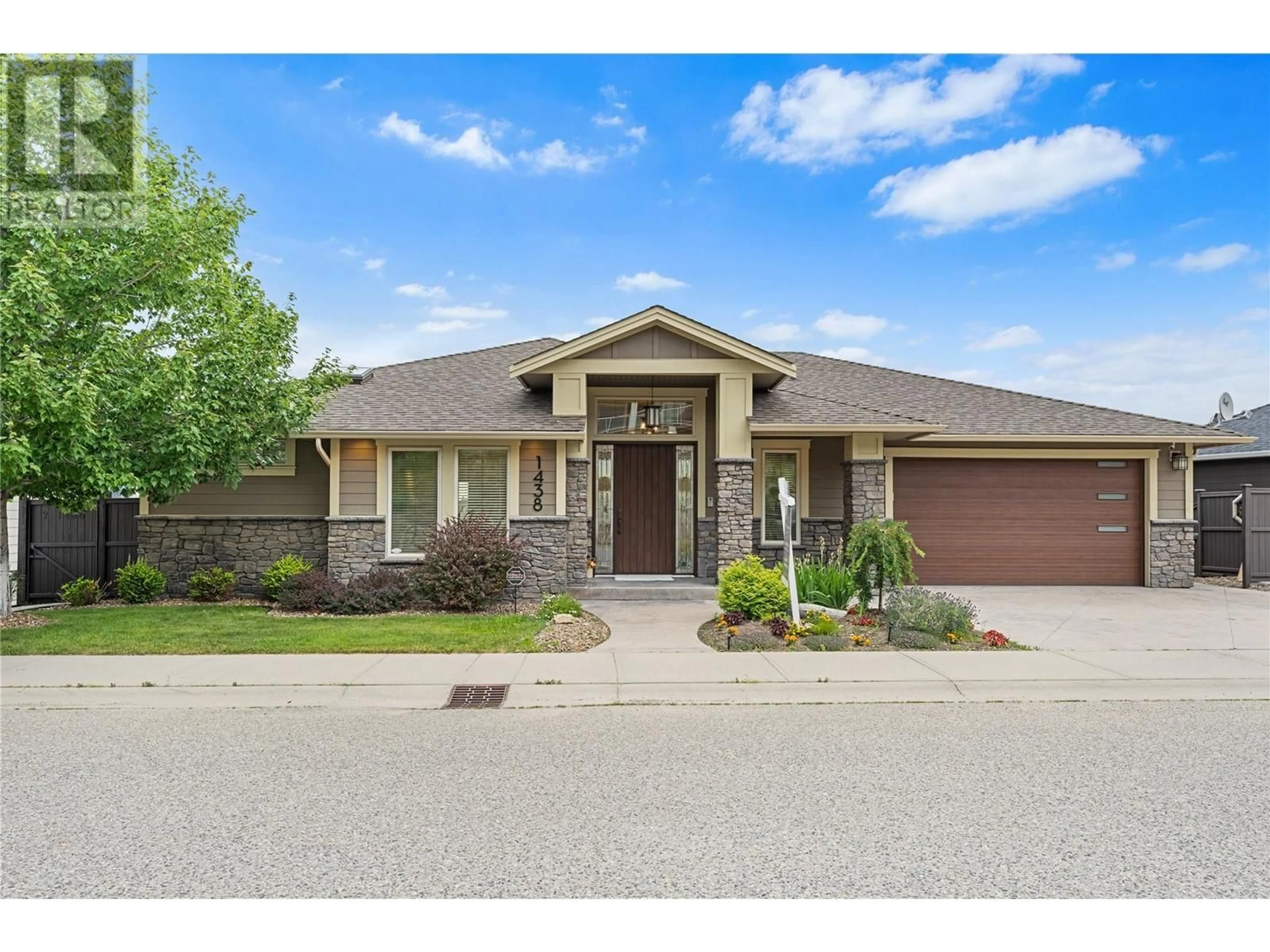 Home with brick exterior material, street for 1438 MONTENEGRO DRIVE, Kelowna British Columbia V1P1R3