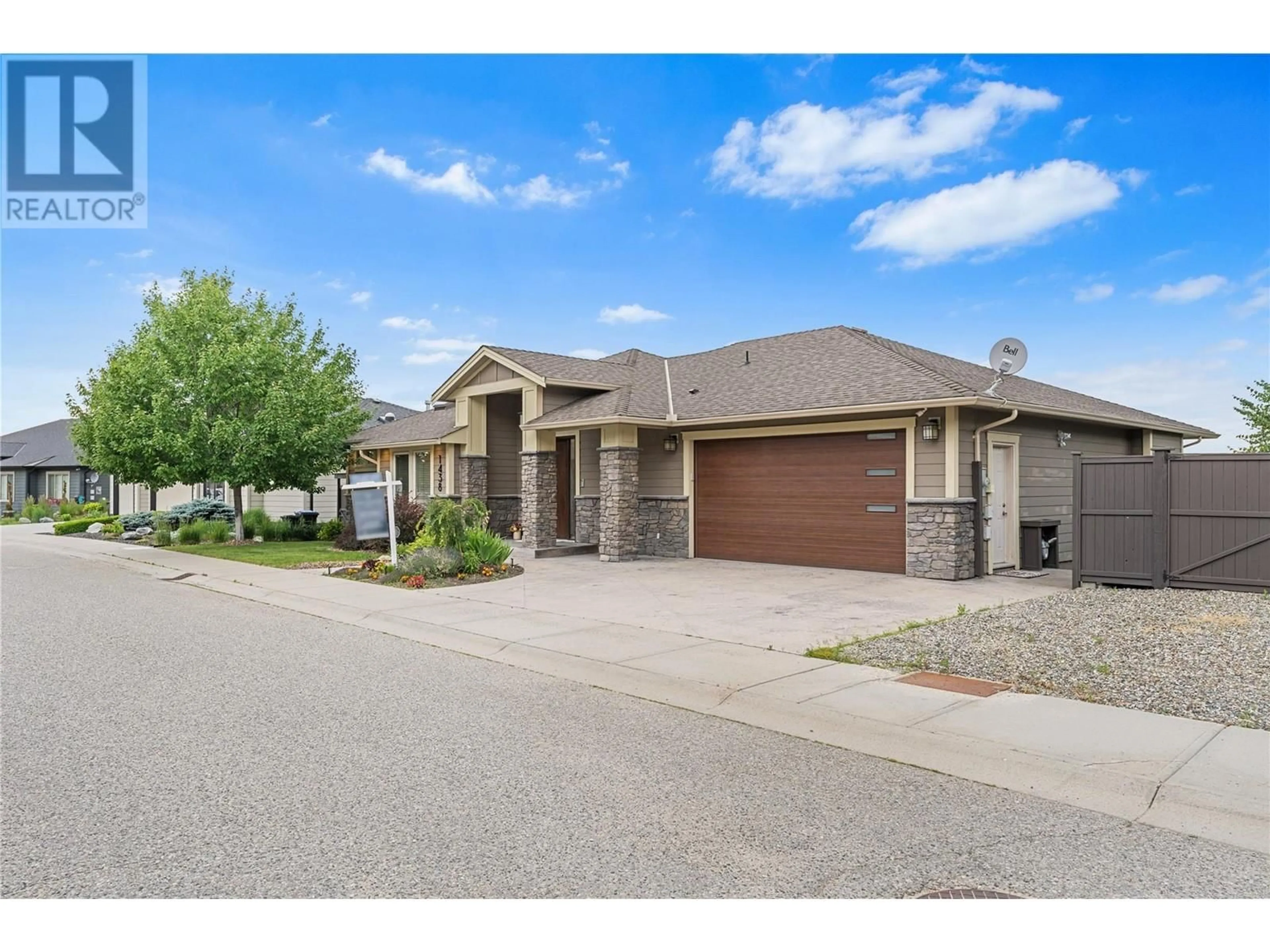 A pic from outside/outdoor area/front of a property/back of a property/a pic from drone, street for 1438 MONTENEGRO DRIVE, Kelowna British Columbia V1P1R3