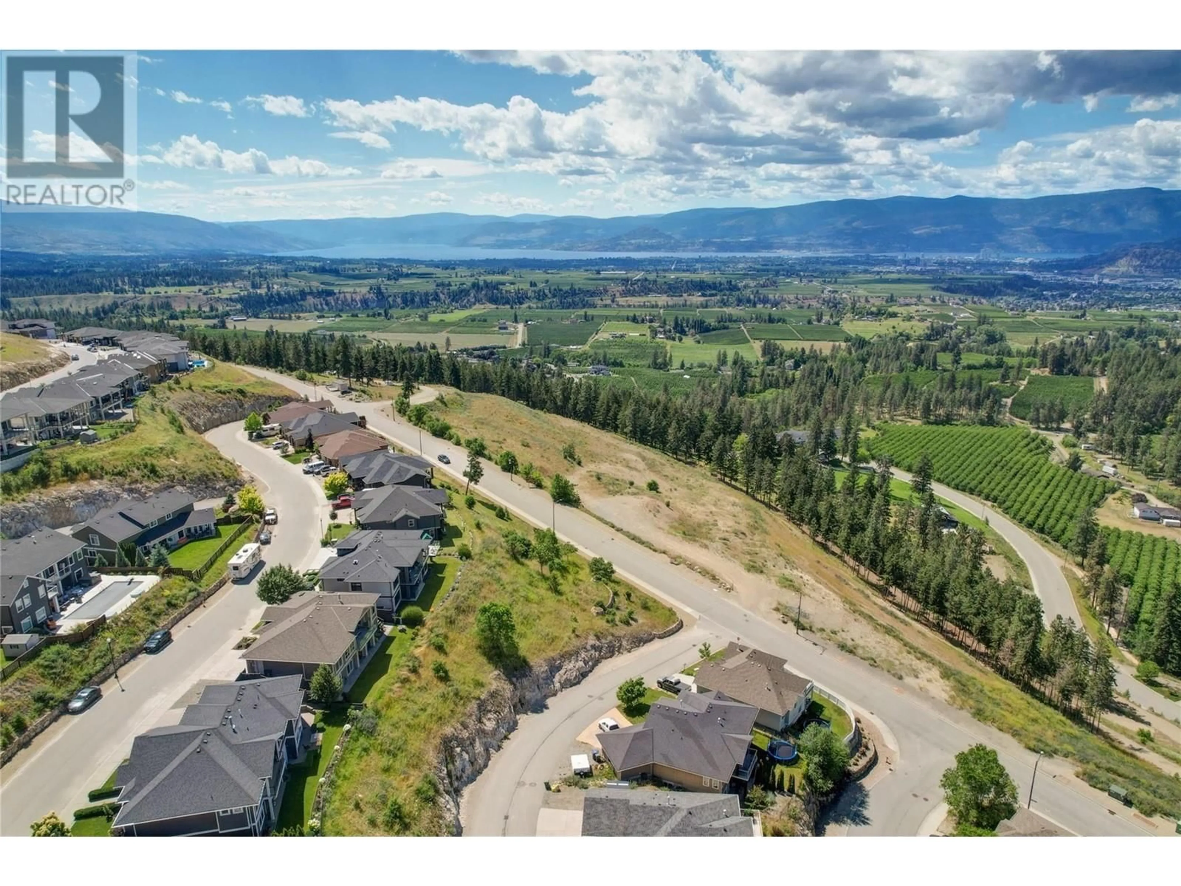 A pic from outside/outdoor area/front of a property/back of a property/a pic from drone, mountain view for 1438 MONTENEGRO DRIVE, Kelowna British Columbia V1P1R3
