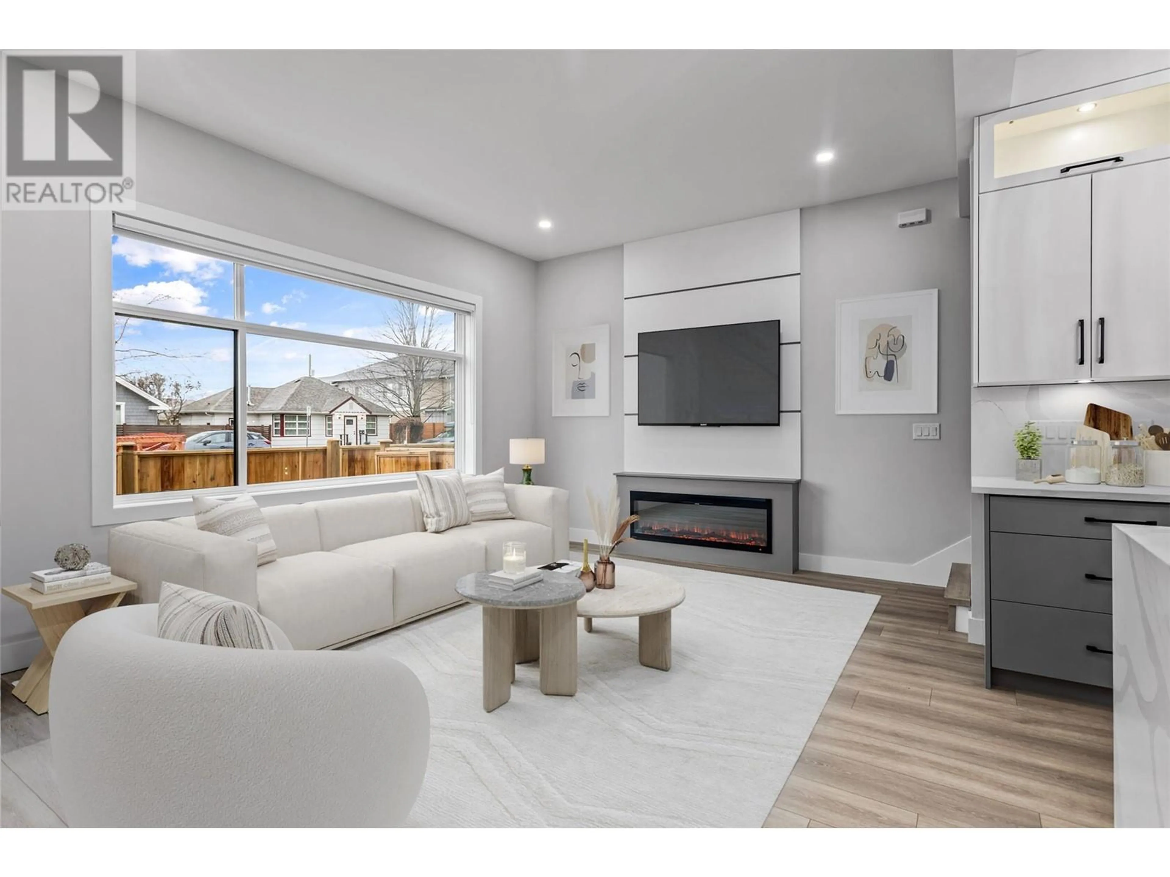 Living room with furniture, wood/laminate floor for 2 - 954 STOCKWELL AVENUE, Kelowna British Columbia V1Y6W2