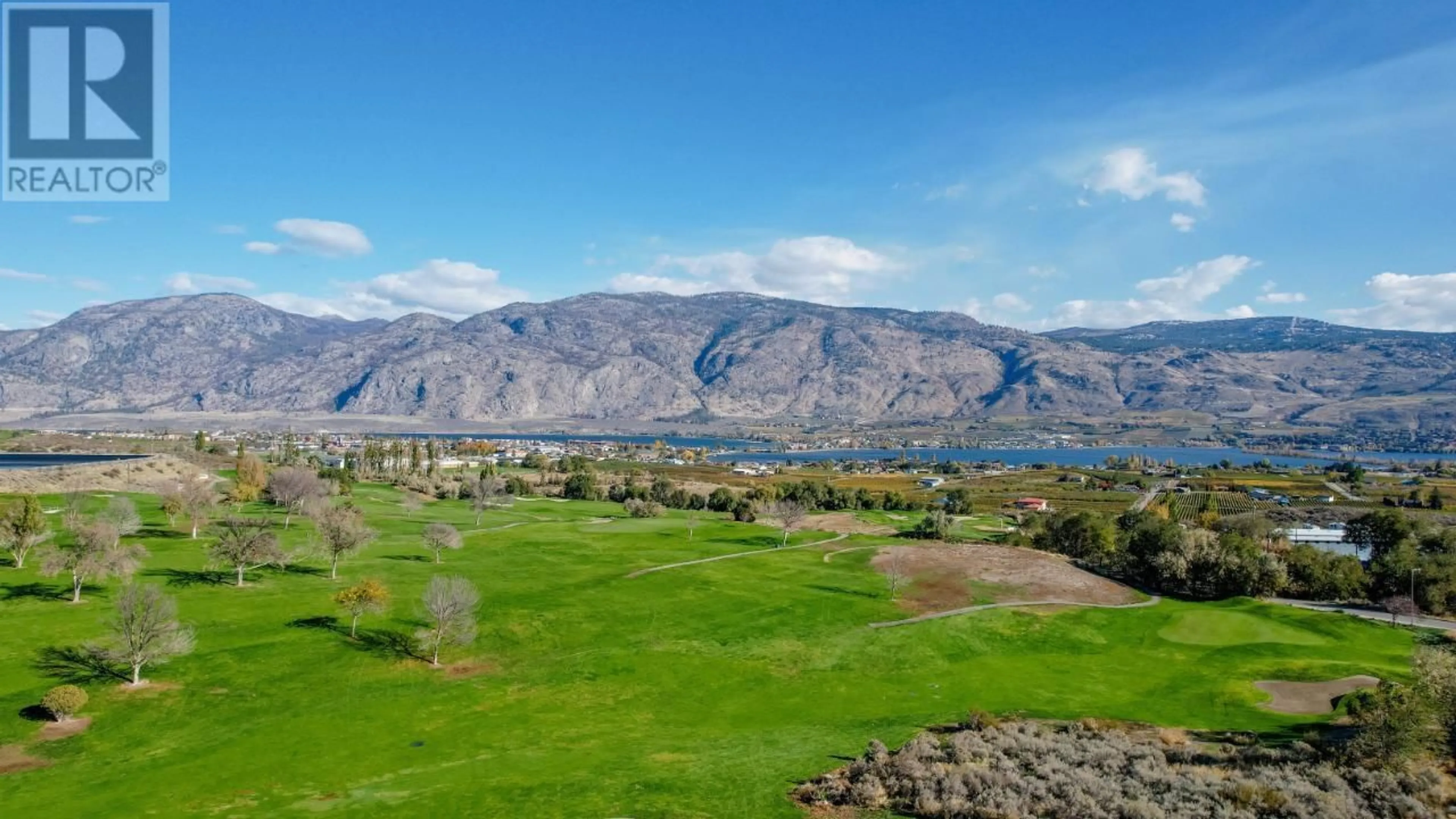 A pic from outside/outdoor area/front of a property/back of a property/a pic from drone, mountain view for 11706 GOLF COURSE Drive, Osoyoos British Columbia V0H1V4