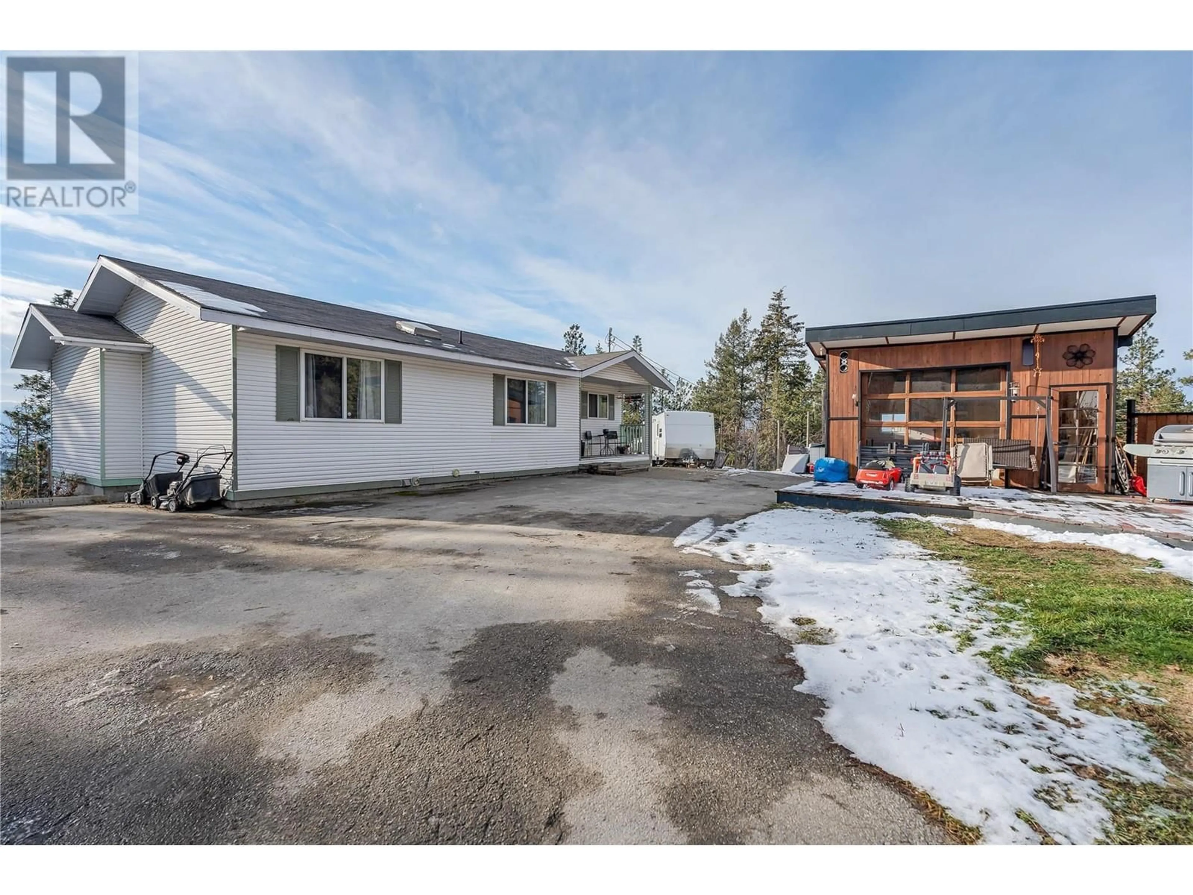 A pic from outside/outdoor area/front of a property/back of a property/a pic from drone, street for 1450 Smethurst Place, Naramata British Columbia V0H1N1