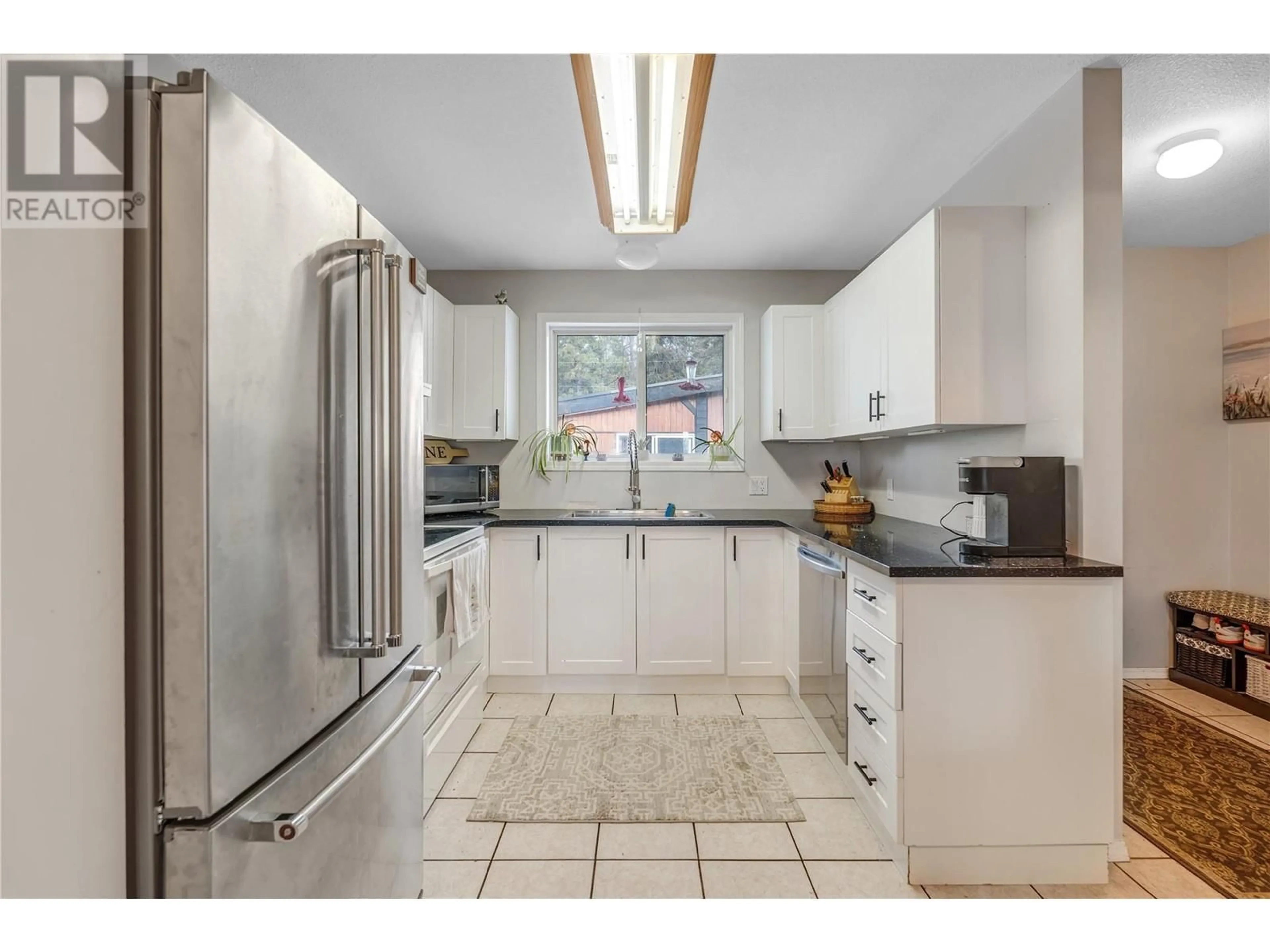 Standard kitchen, ceramic/tile floor for 1450 Smethurst Place, Naramata British Columbia V0H1N1