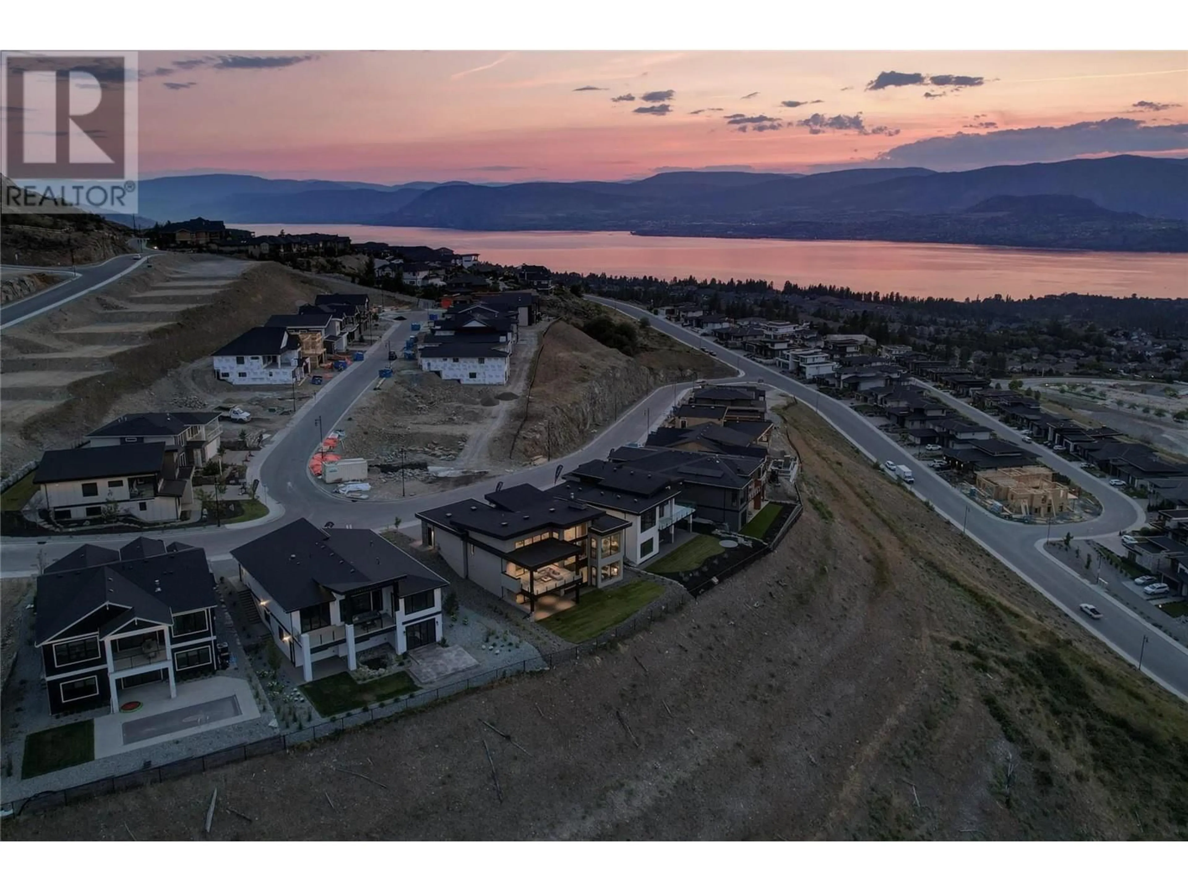 A pic from outside/outdoor area/front of a property/back of a property/a pic from drone, mountain view for 1054 Emslie Street, Kelowna British Columbia V1W5J1