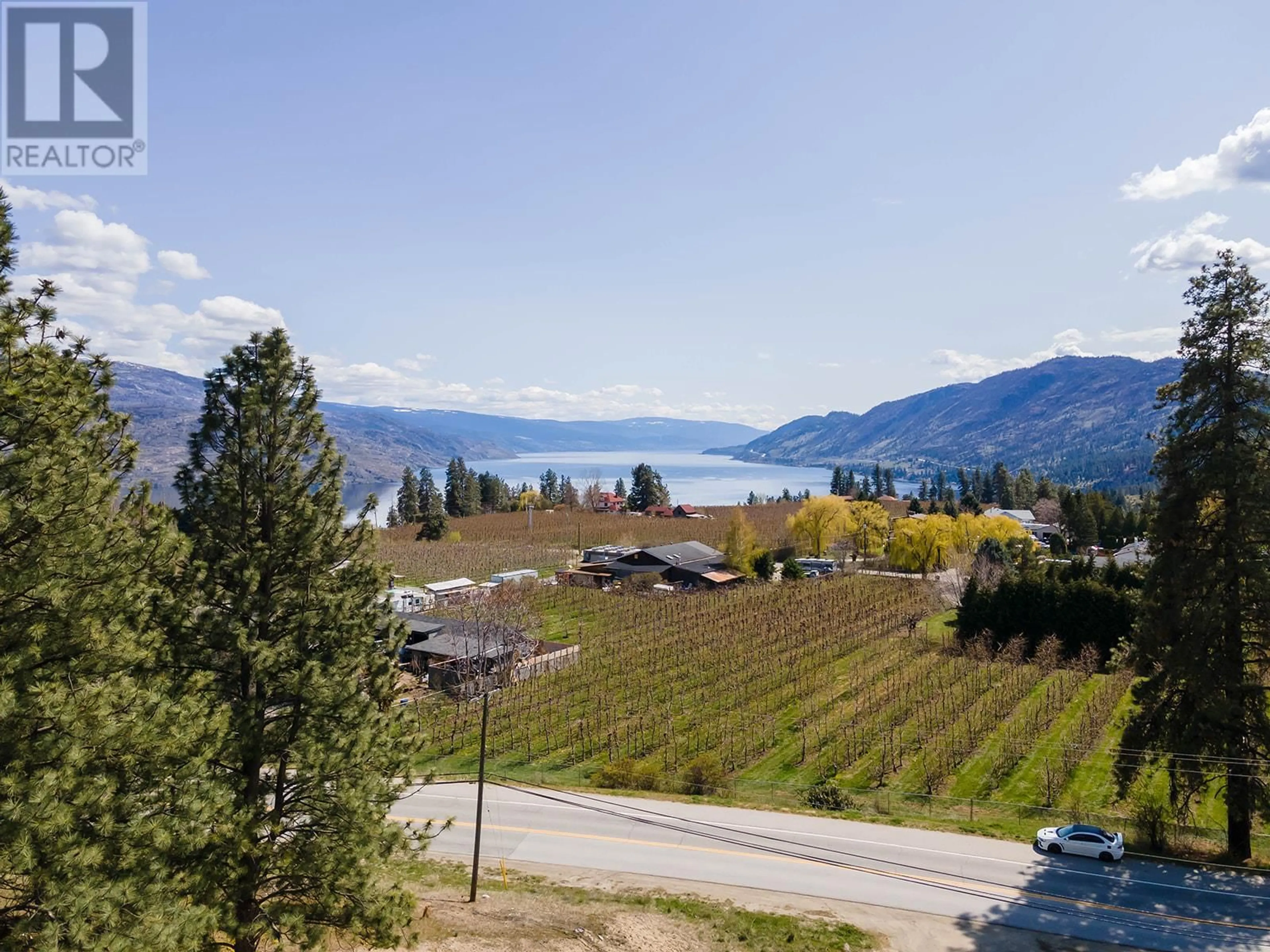 A pic from outside/outdoor area/front of a property/back of a property/a pic from drone, water/lake/river/ocean view for 4976 Princeton Avenue, Peachland British Columbia V0H1X8