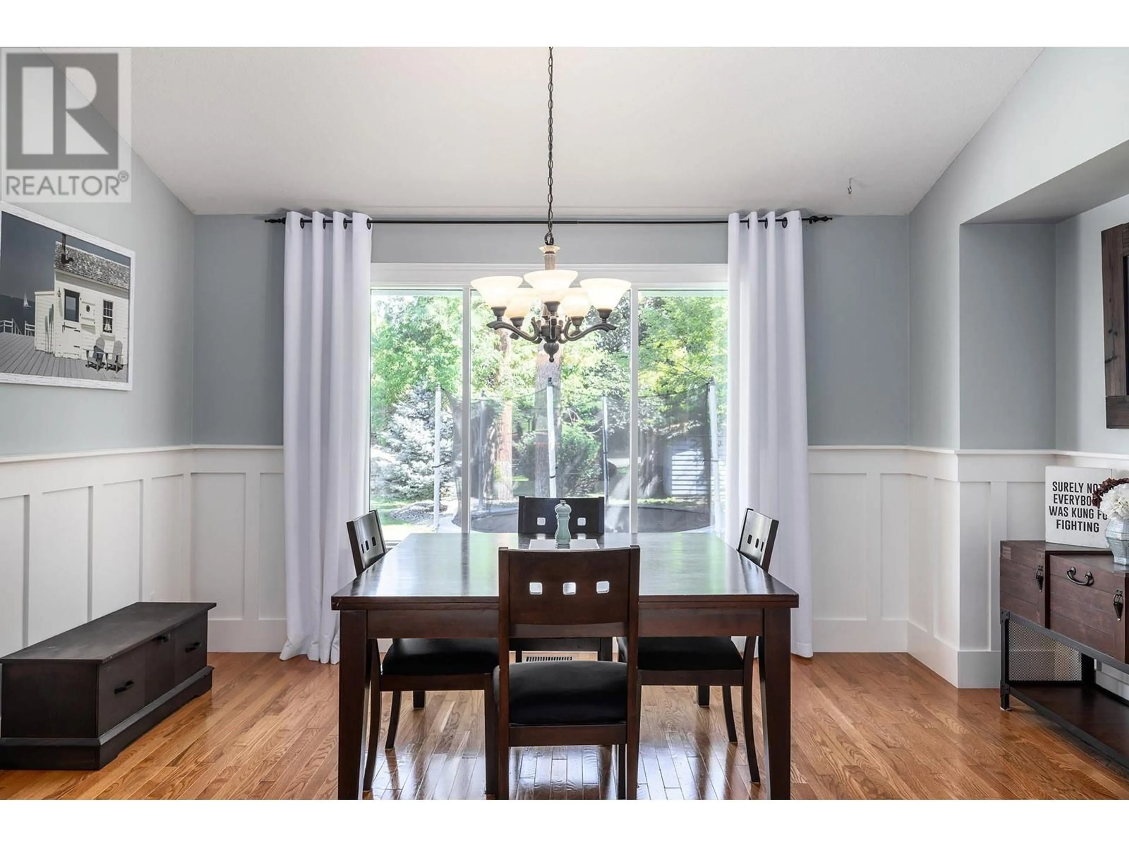 Dining room, wood/laminate floor for 480 Curlew Drive, Kelowna British Columbia V1W4L1