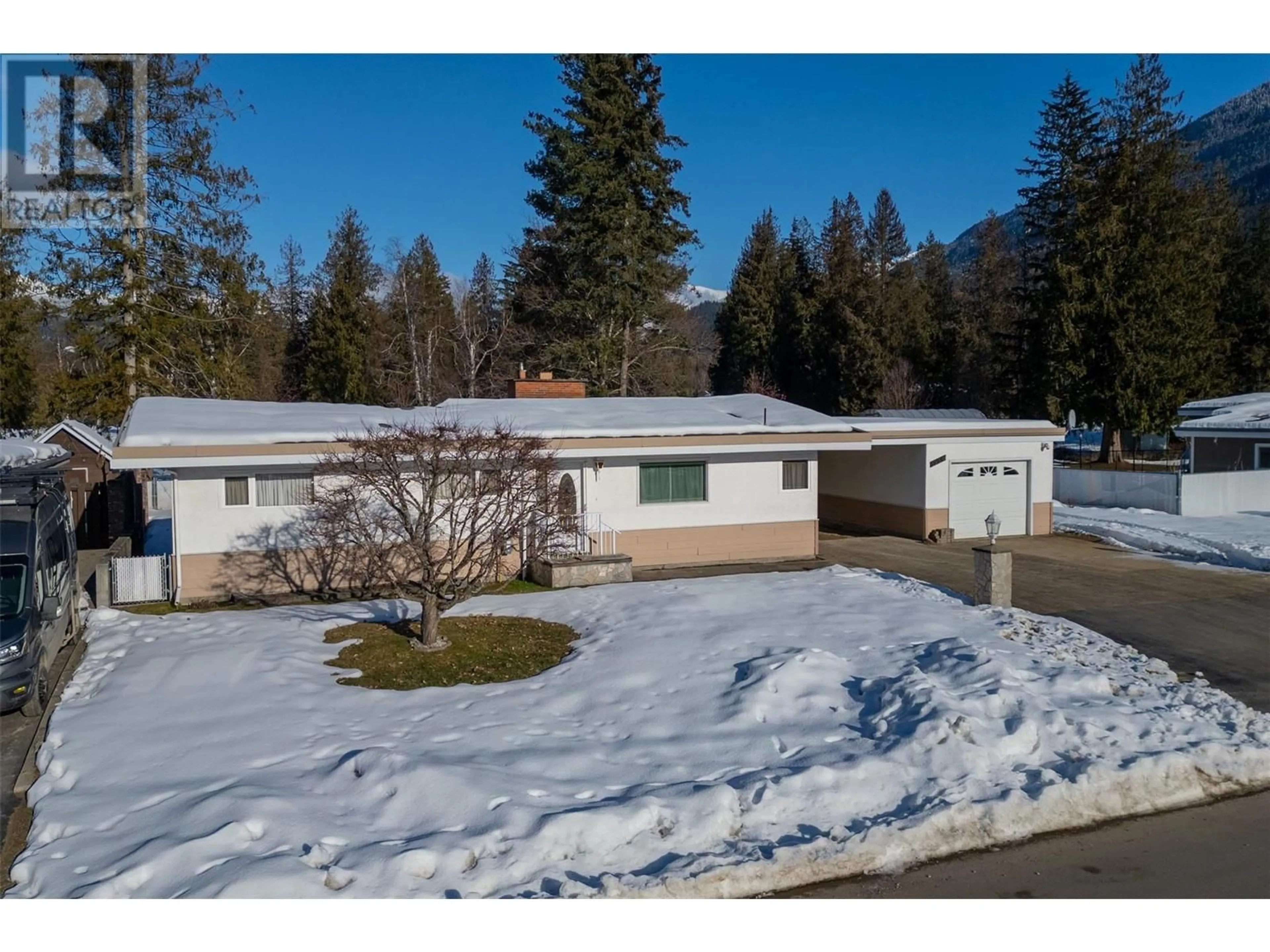 A pic from outside/outdoor area/front of a property/back of a property/a pic from drone, street for 1956 Fairway Road, Revelstoke British Columbia V0E2S0