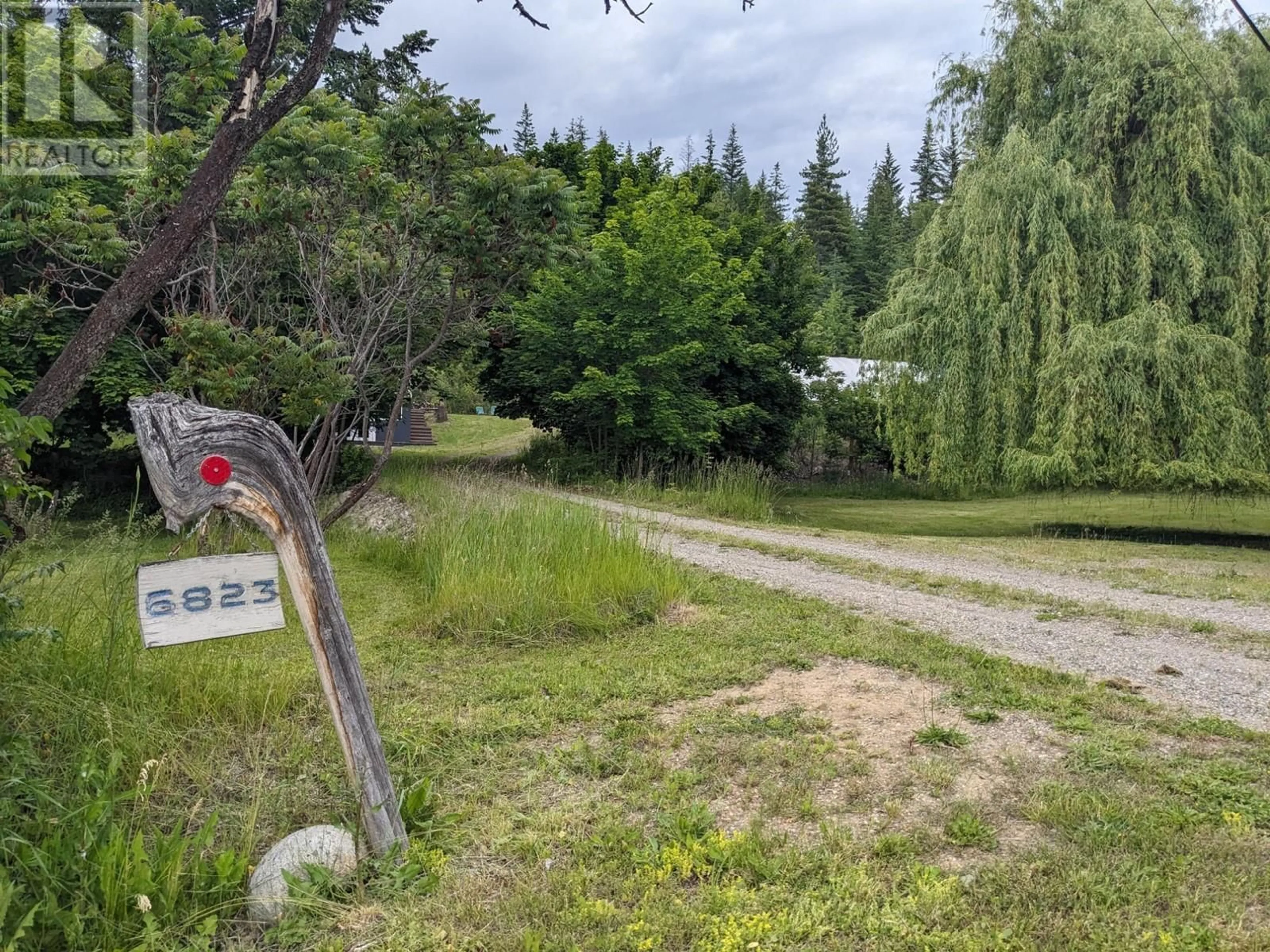 A pic from outside/outdoor area/front of a property/back of a property/a pic from drone, forest/trees view for 6823 CHARLESON ROAD, North Shuswap British Columbia V0E1M7