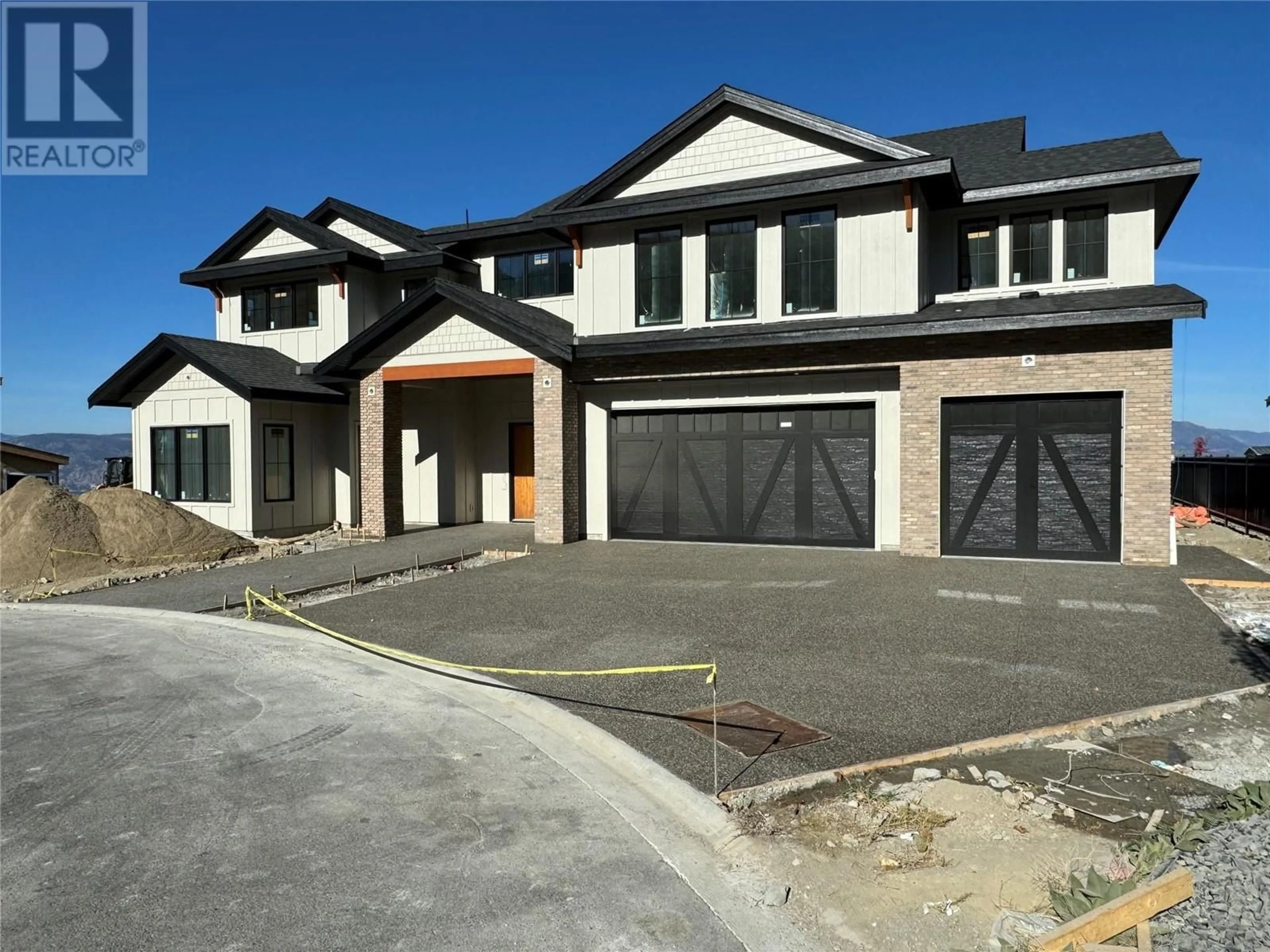 Home with brick exterior material, street for 5631 Upper Mission Court, Kelowna British Columbia V1W0C5