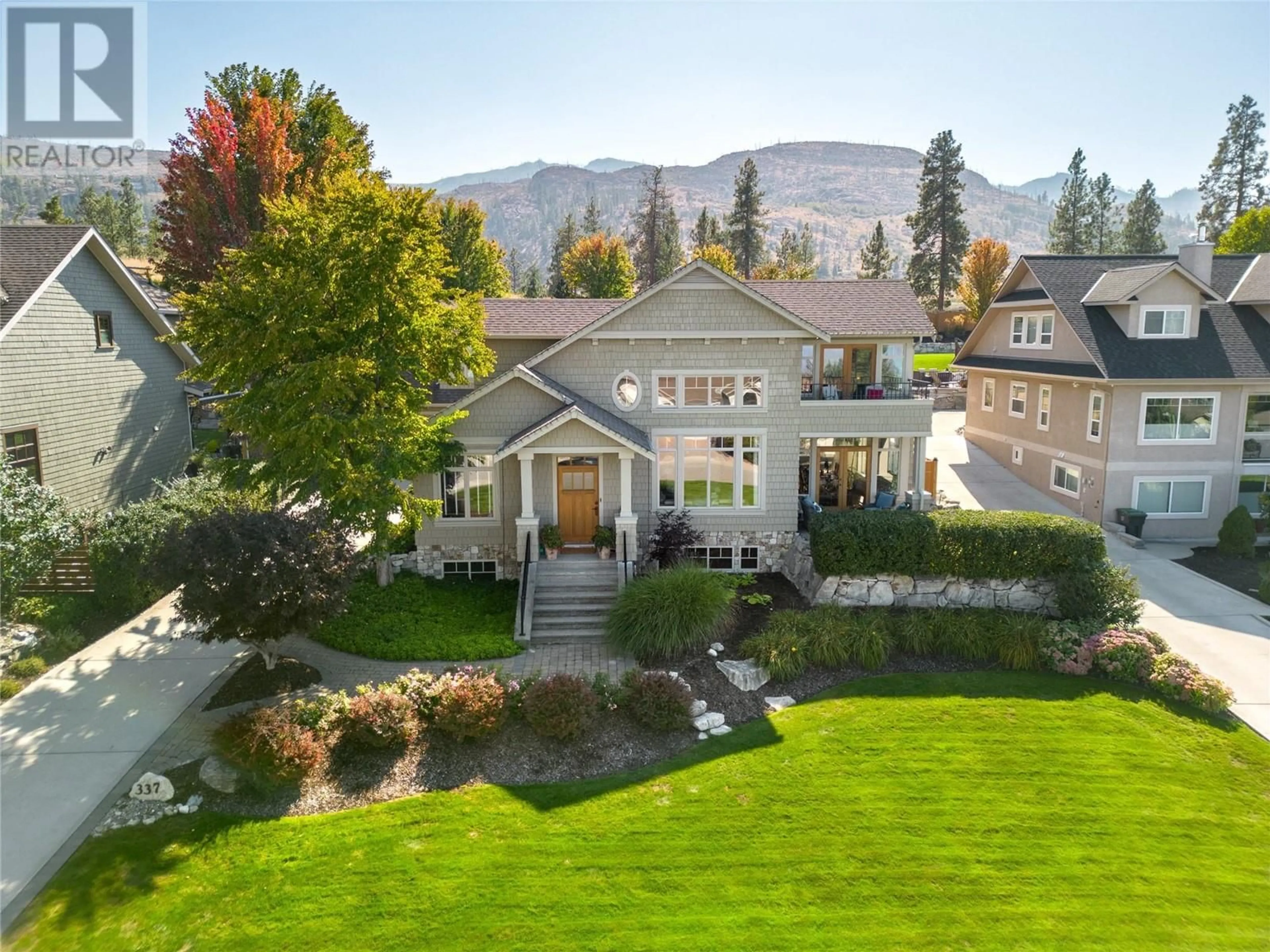 A pic from outside/outdoor area/front of a property/back of a property/a pic from drone, mountain view for 337 Tanager Drive, Kelowna British Columbia V1W4T6