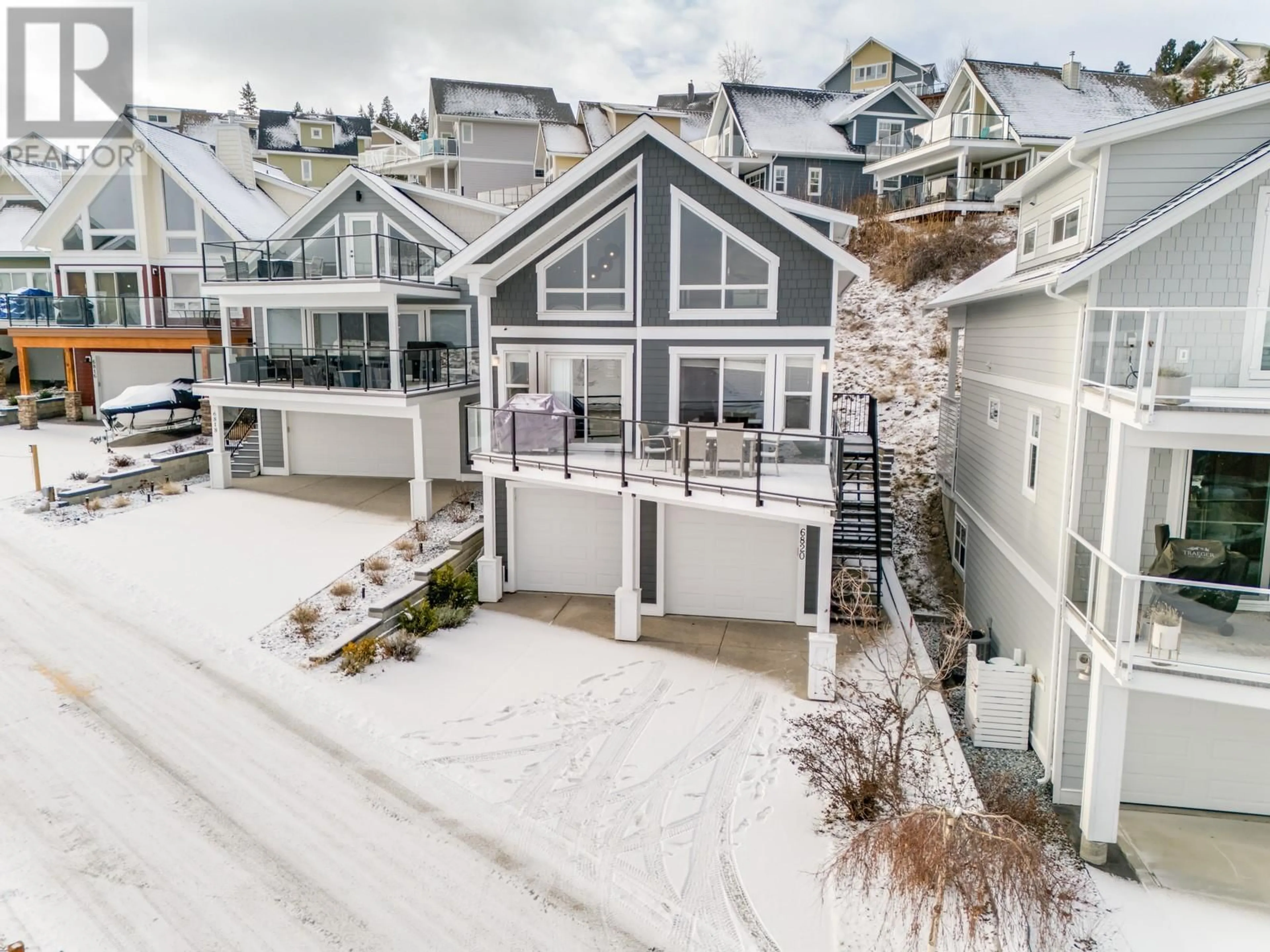 A pic from outside/outdoor area/front of a property/back of a property/a pic from drone, mountain view for 166 - 6820 SANTIAGO LOOP, Kelowna British Columbia V1Z3R8
