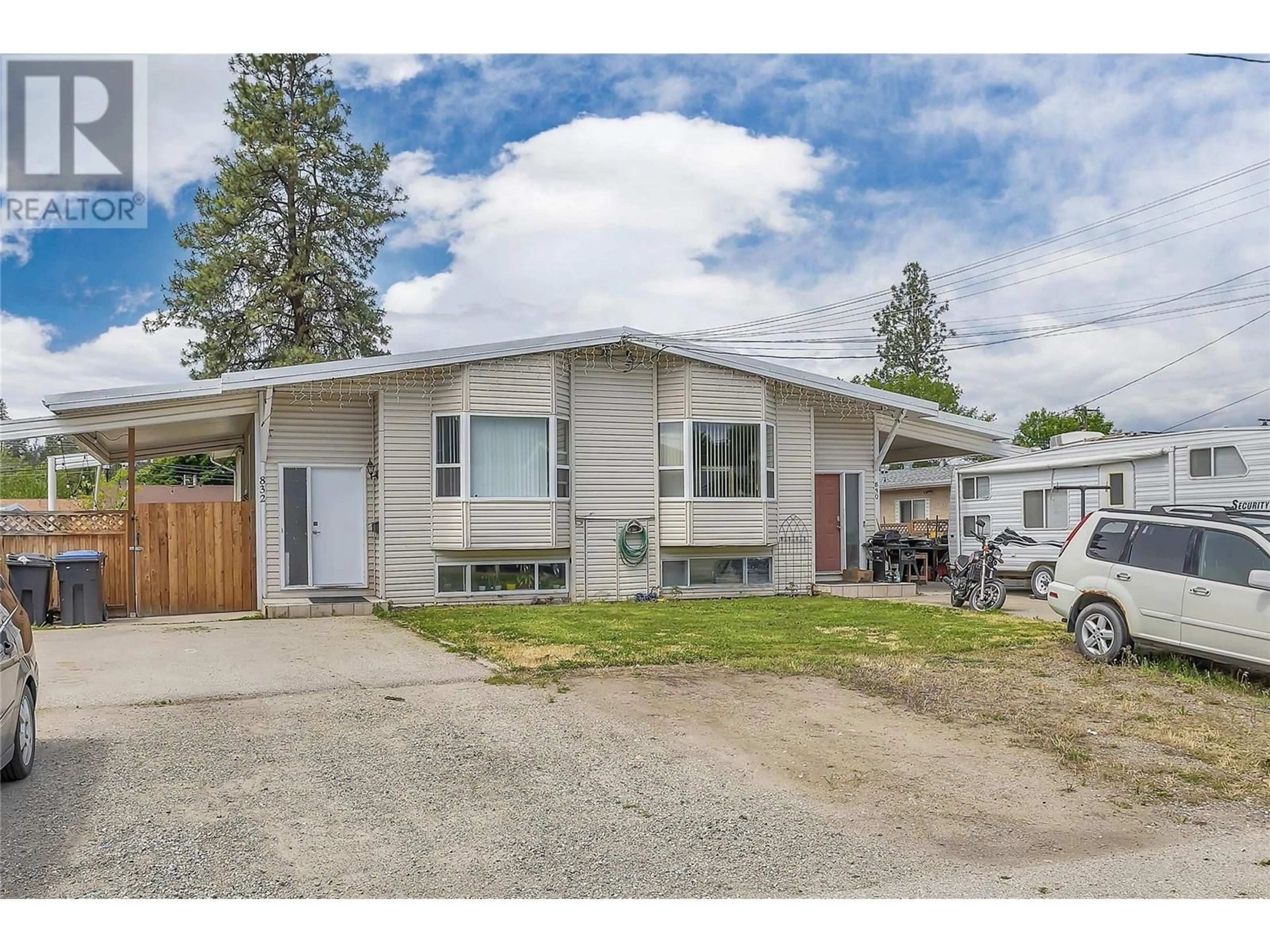 Home with vinyl exterior material, street for 830/832 Irma Road, Kelowna British Columbia V1X3Z9