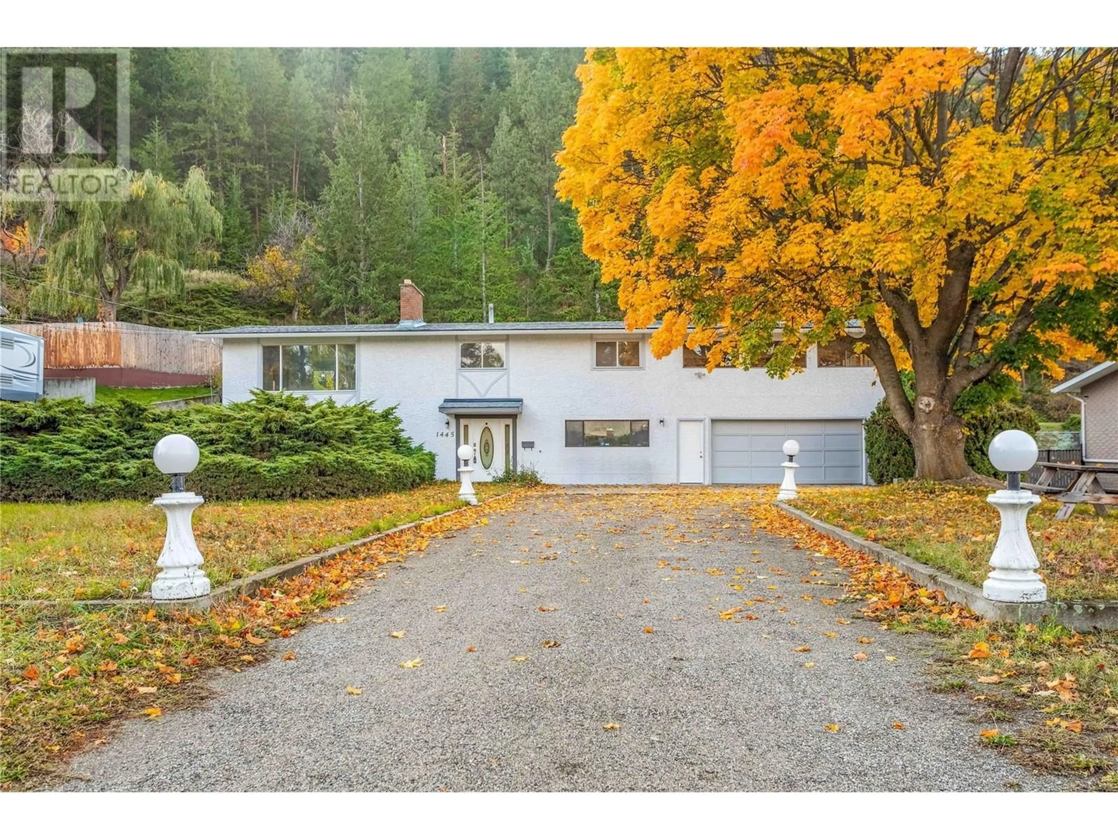 A pic from outside/outdoor area/front of a property/back of a property/a pic from drone, street for 1445 Ponderosa Road, West Kelowna British Columbia V1Z1M9