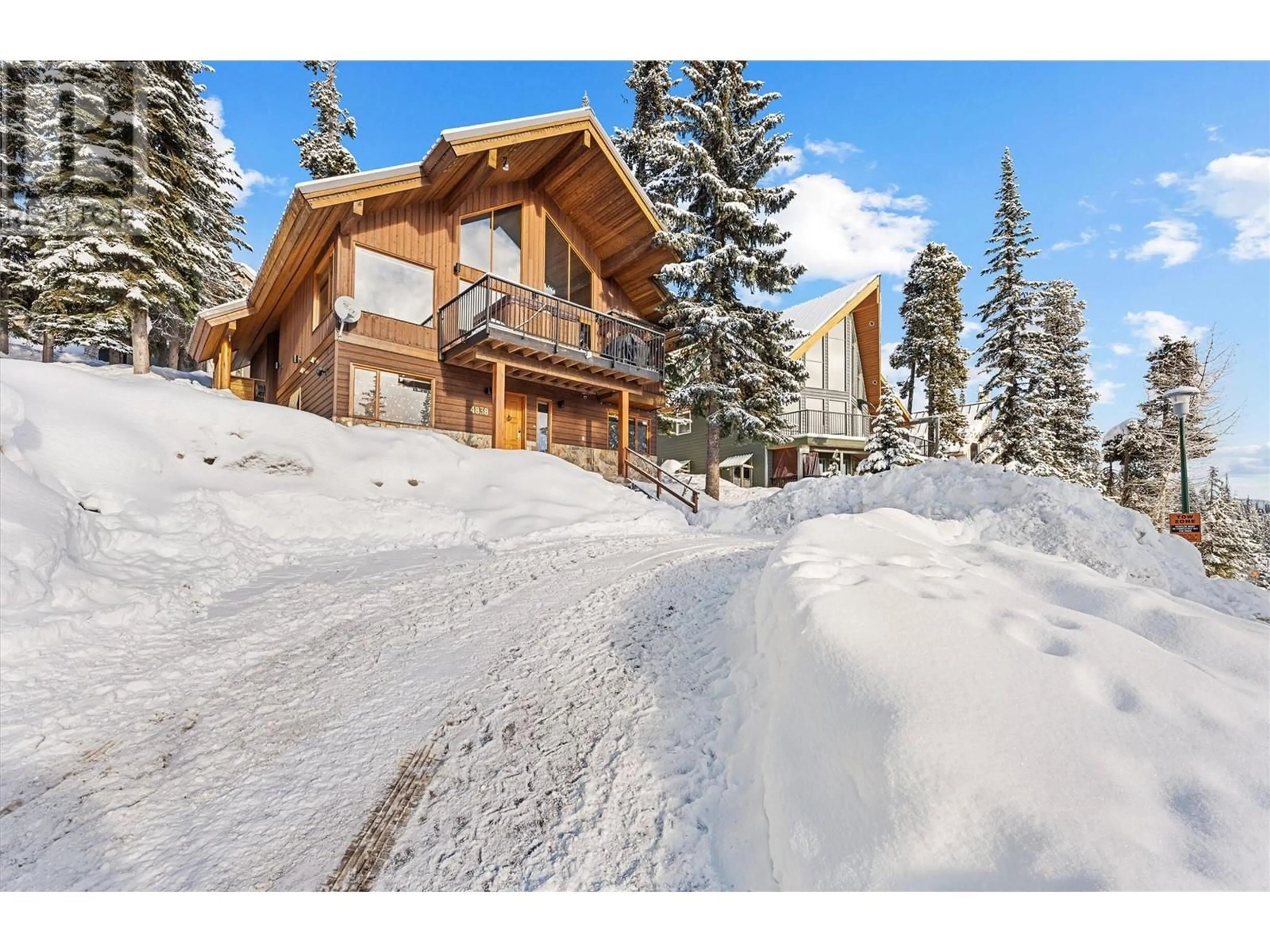 A pic from outside/outdoor area/front of a property/back of a property/a pic from drone, unknown for 4838 Snow Pines Road, Big White British Columbia V1P1P3