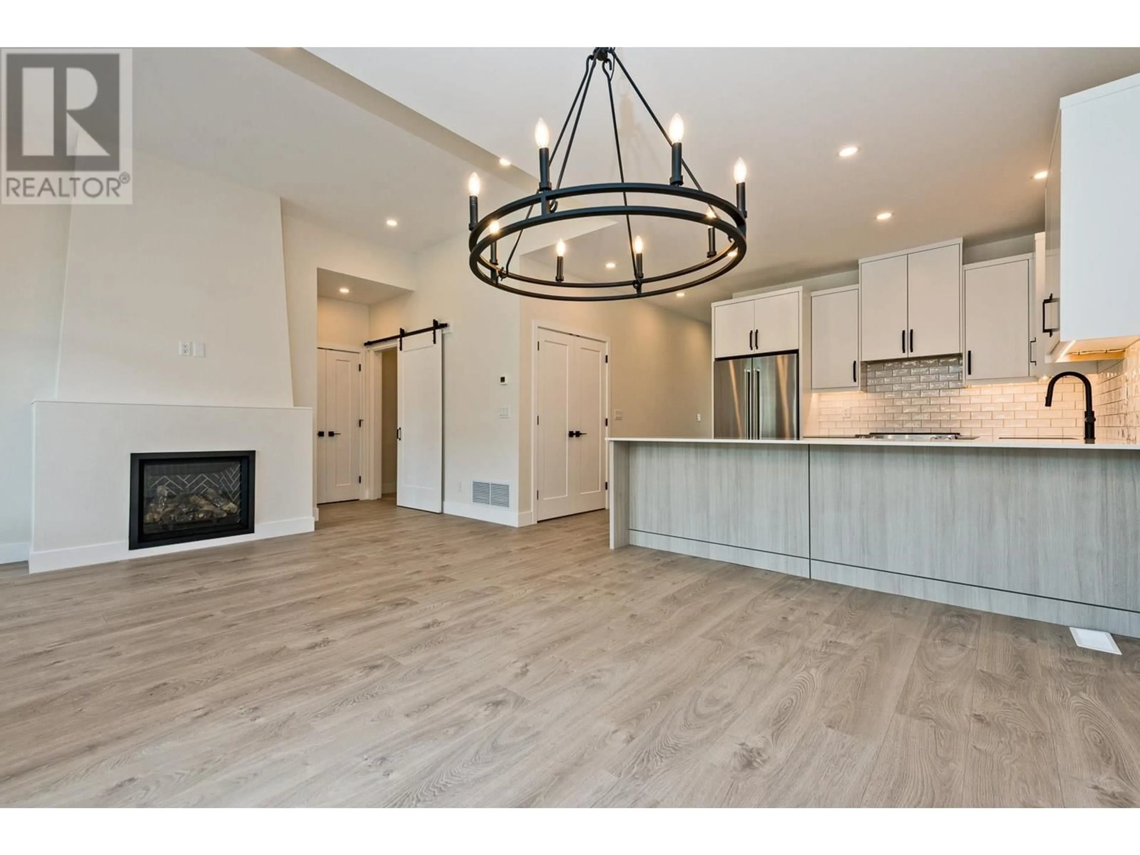 Open concept kitchen, wood/laminate floor for 8000 VEDETTE Drive Unit# 2, Osoyoos British Columbia V0H1V2