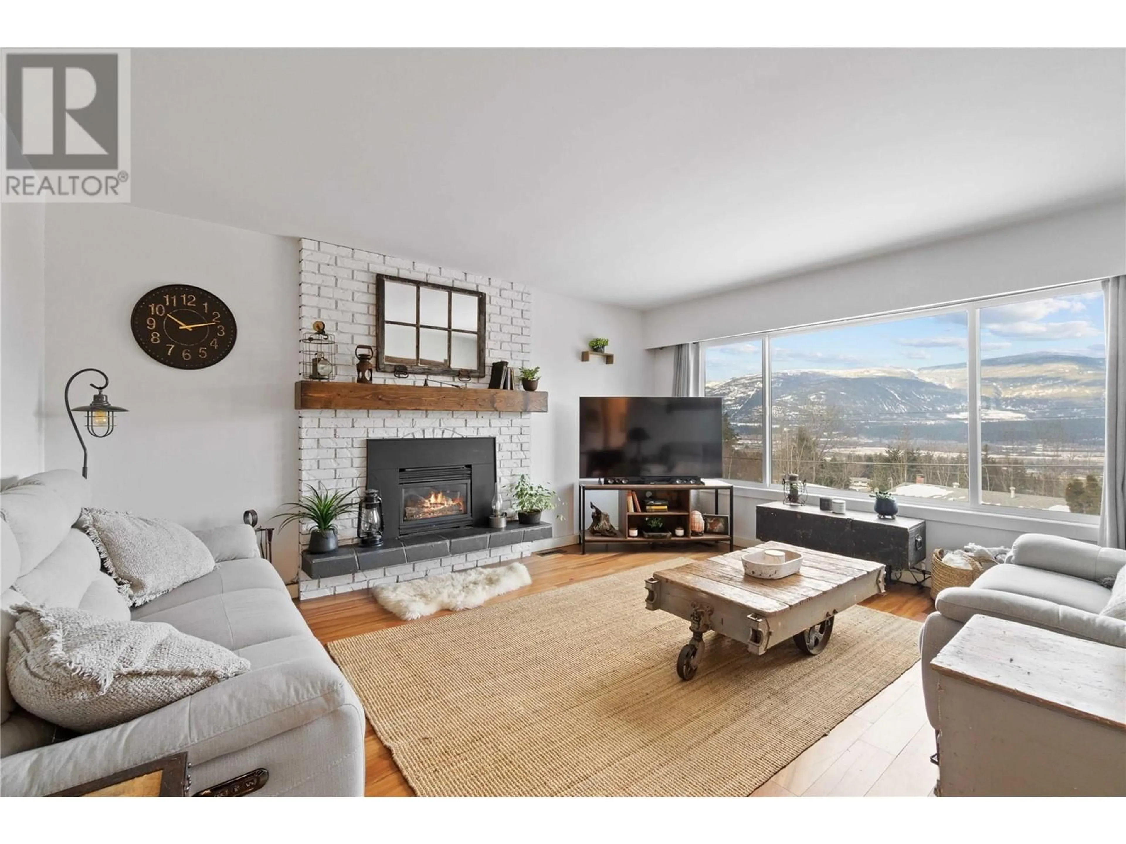 Living room with furniture, wood/laminate floor for 1860 9 Avenue SE, Salmon Arm British Columbia V1E2J5