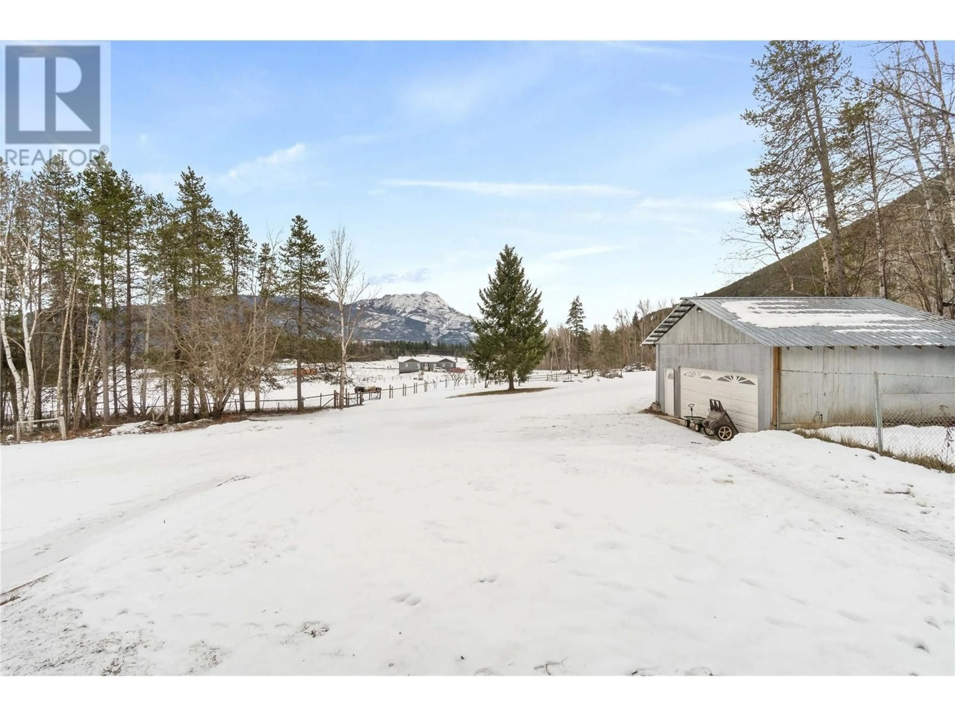 A pic from outside/outdoor area/front of a property/back of a property/a pic from drone, mountain view for 1091 60 Street NW, Salmon Arm British Columbia V1E4M2