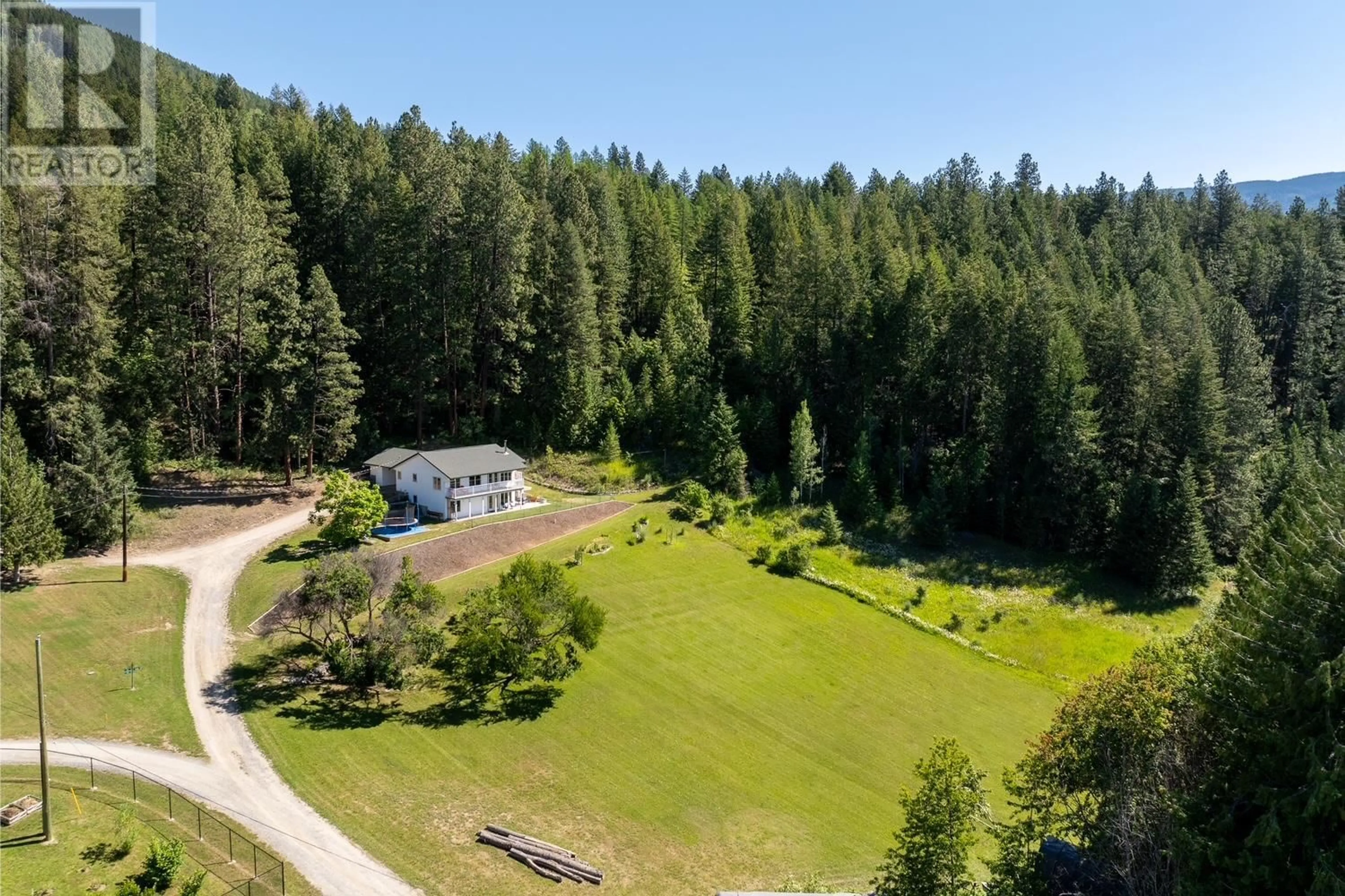 A pic from outside/outdoor area/front of a property/back of a property/a pic from drone, forest/trees view for 410 27TH  N Avenue, Erickson British Columbia V0B1G1