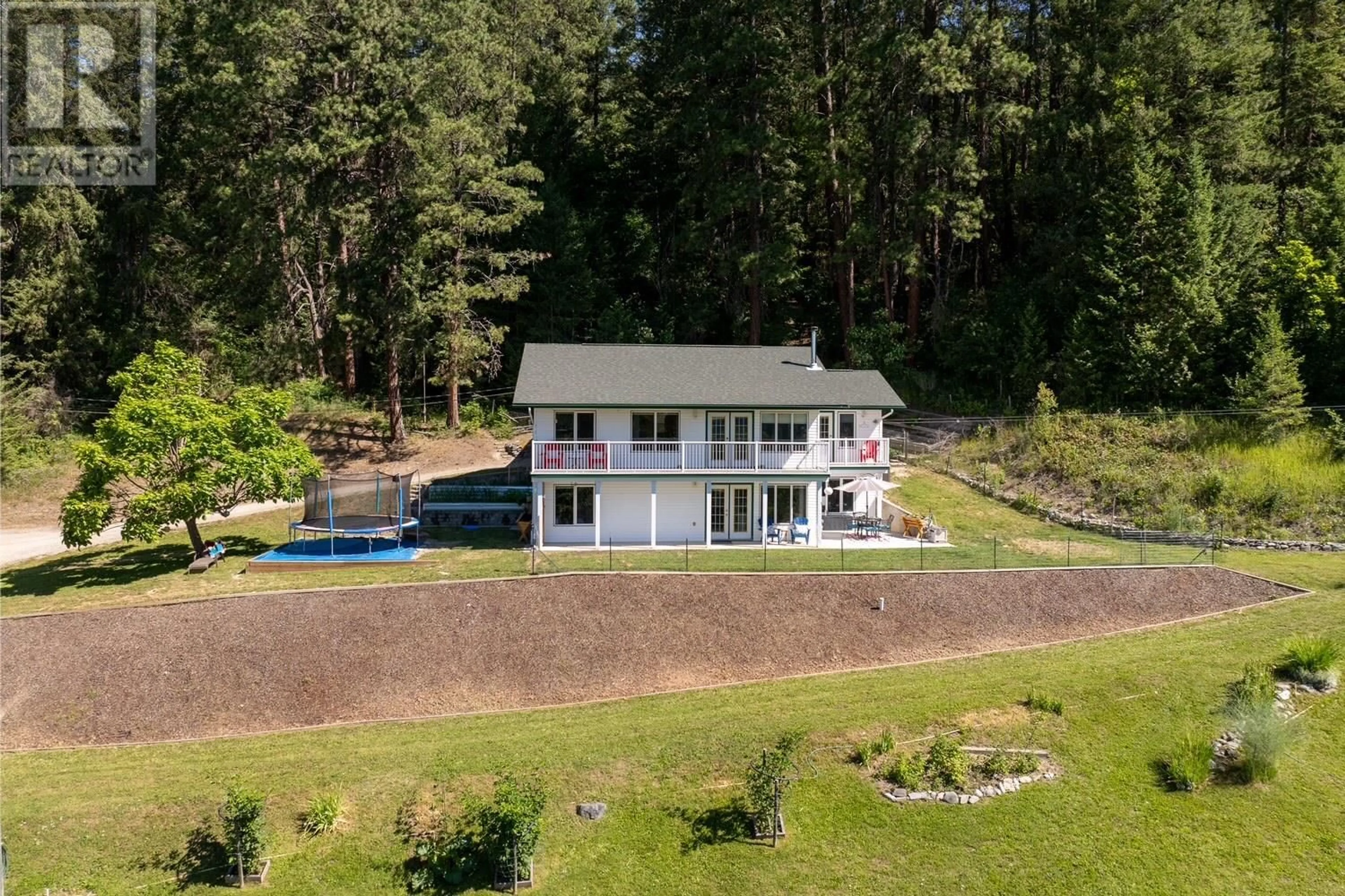 A pic from outside/outdoor area/front of a property/back of a property/a pic from drone, water/lake/river/ocean view for 410 27TH  N Avenue, Erickson British Columbia V0B1G1