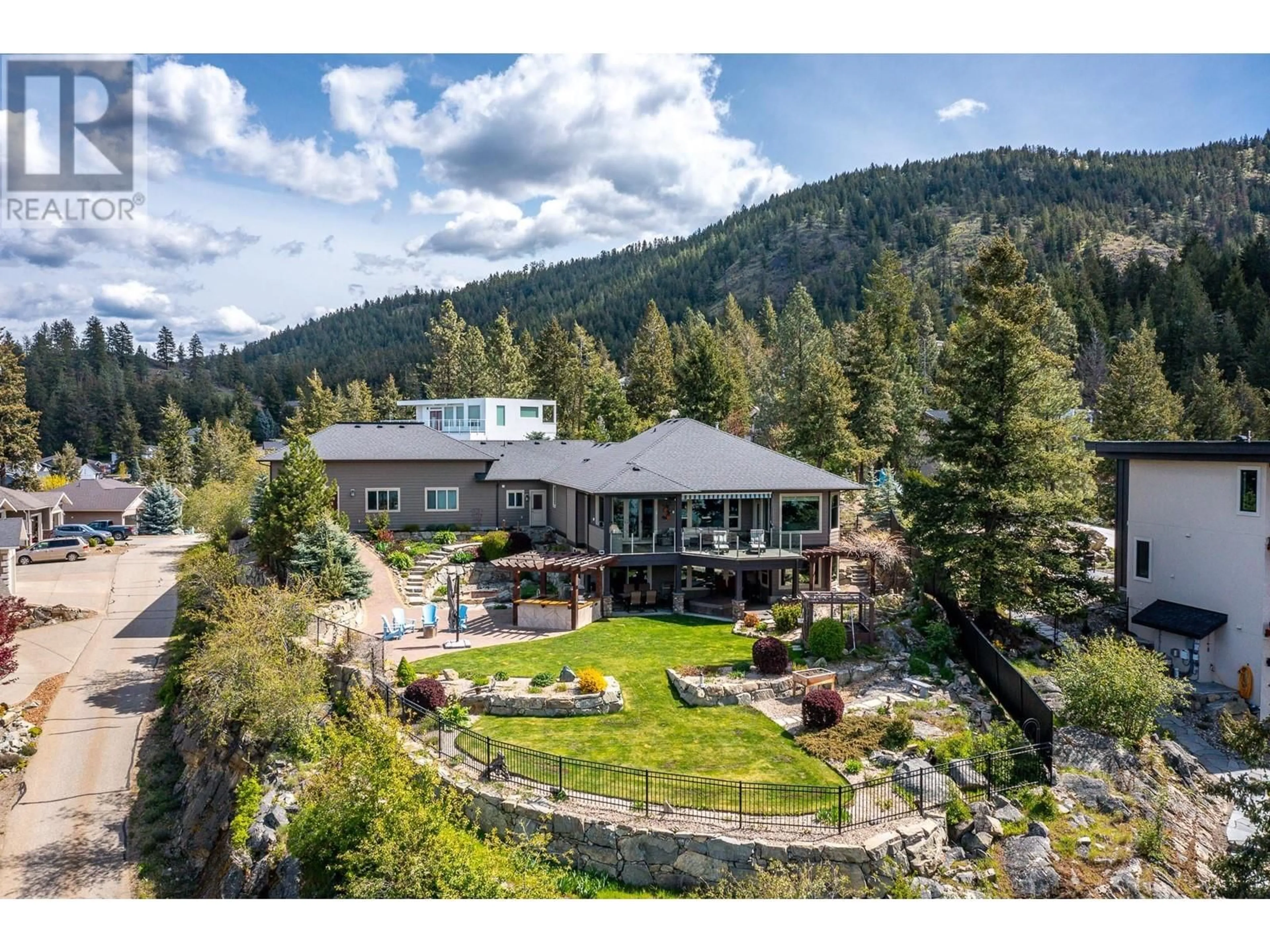 A pic from outside/outdoor area/front of a property/back of a property/a pic from drone, mountain view for 69 Swallows Place, Vernon British Columbia V1H1F4