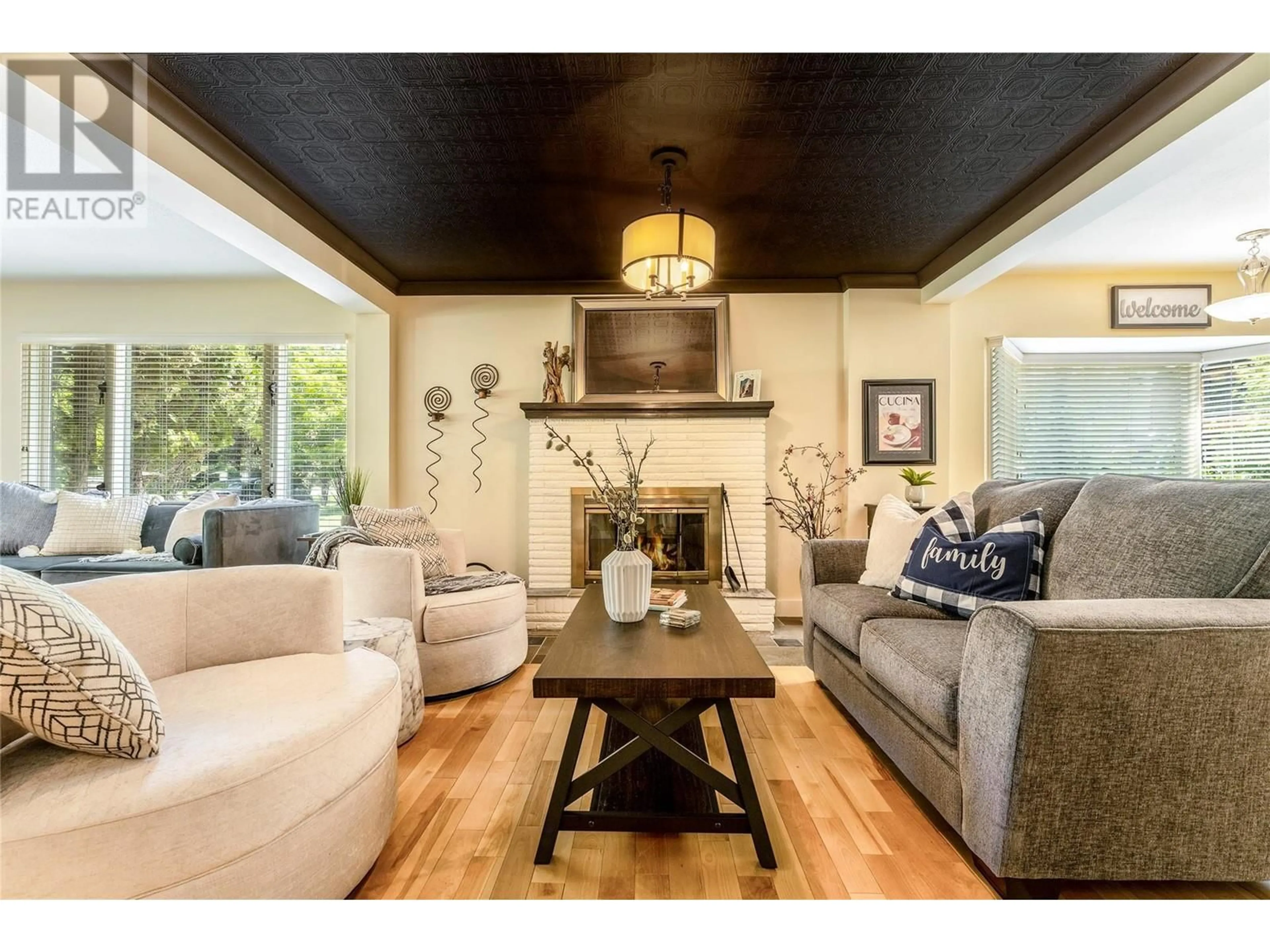 Living room with furniture, wood/laminate floor for 1795 VICTORIA Avenue, Windermere British Columbia V0B2L2