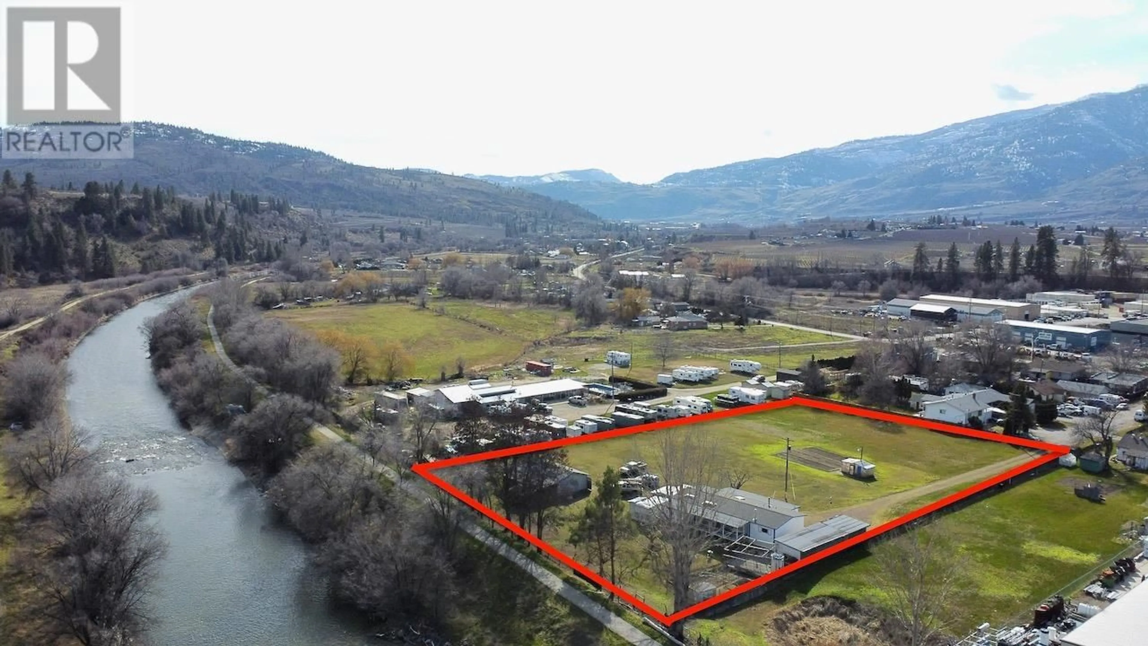 A pic from outside/outdoor area/front of a property/back of a property/a pic from drone, water/lake/river/ocean view for 129 Walnut Place, Oliver British Columbia V0H1T9