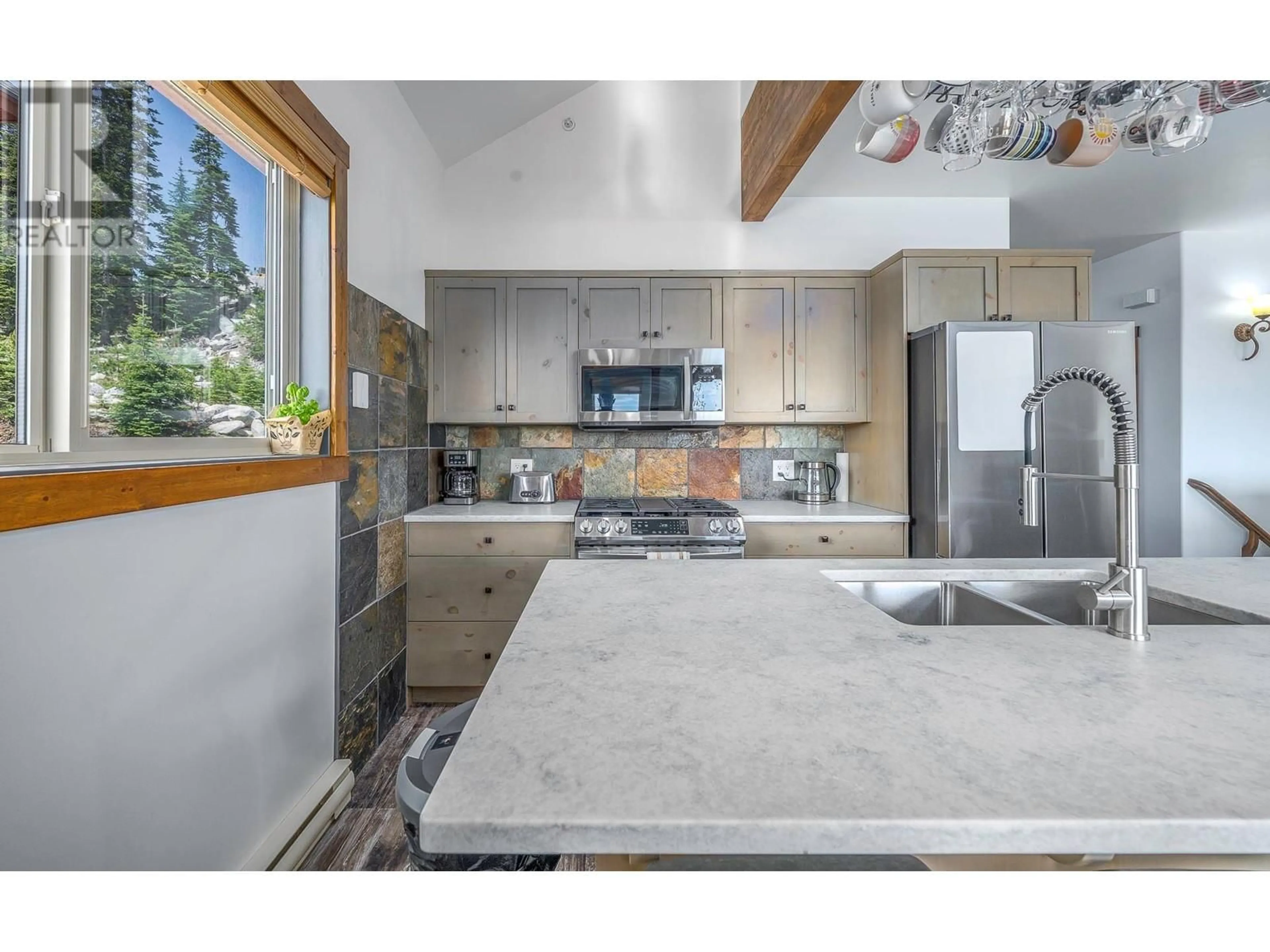 Open concept kitchen, ceramic/tile floor for 70B FOREST LANE, Big White British Columbia V1P1P3