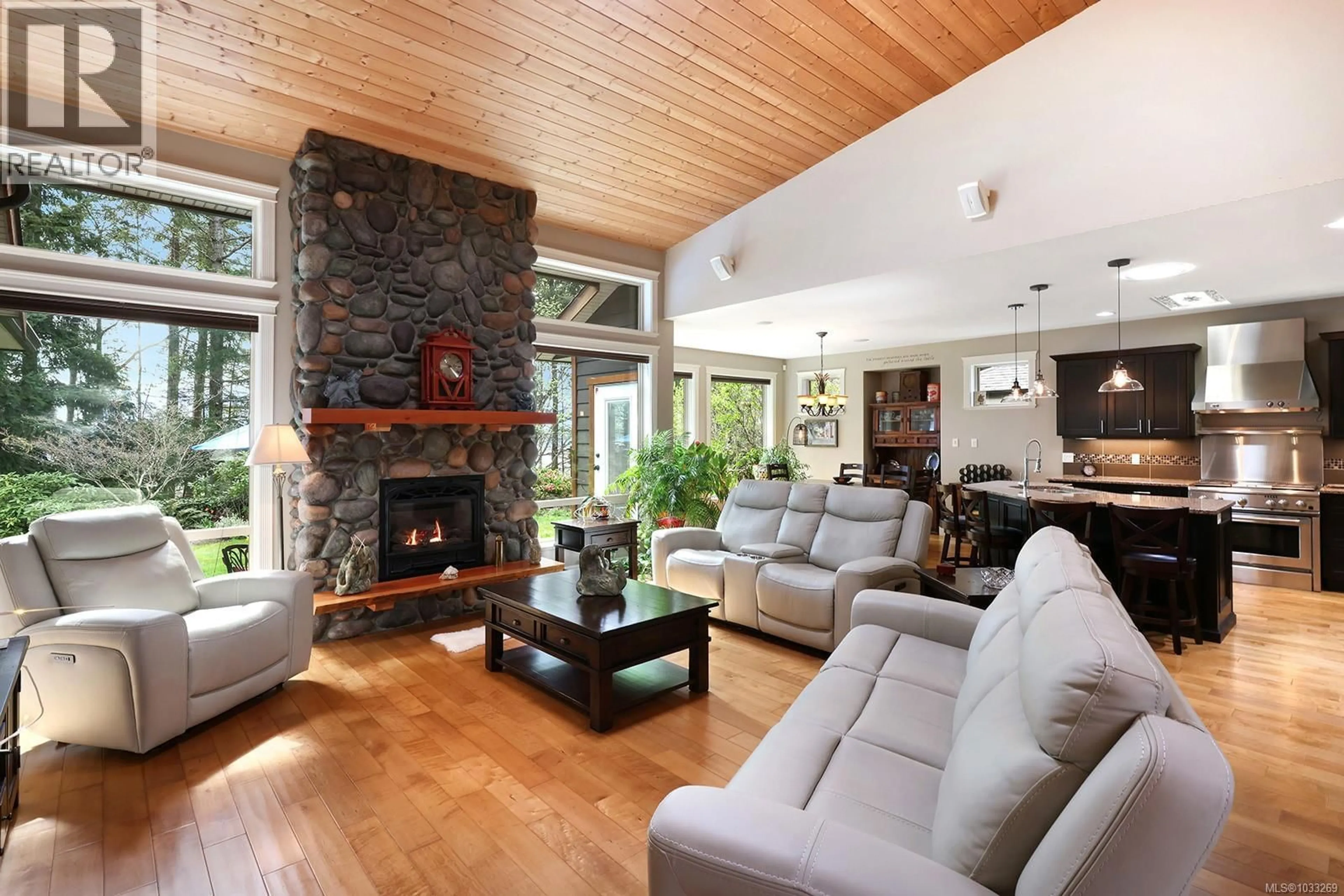 Living room with furniture, wood/laminate floor for 2407 TUTOR DRIVE, Comox British Columbia V9M0A7