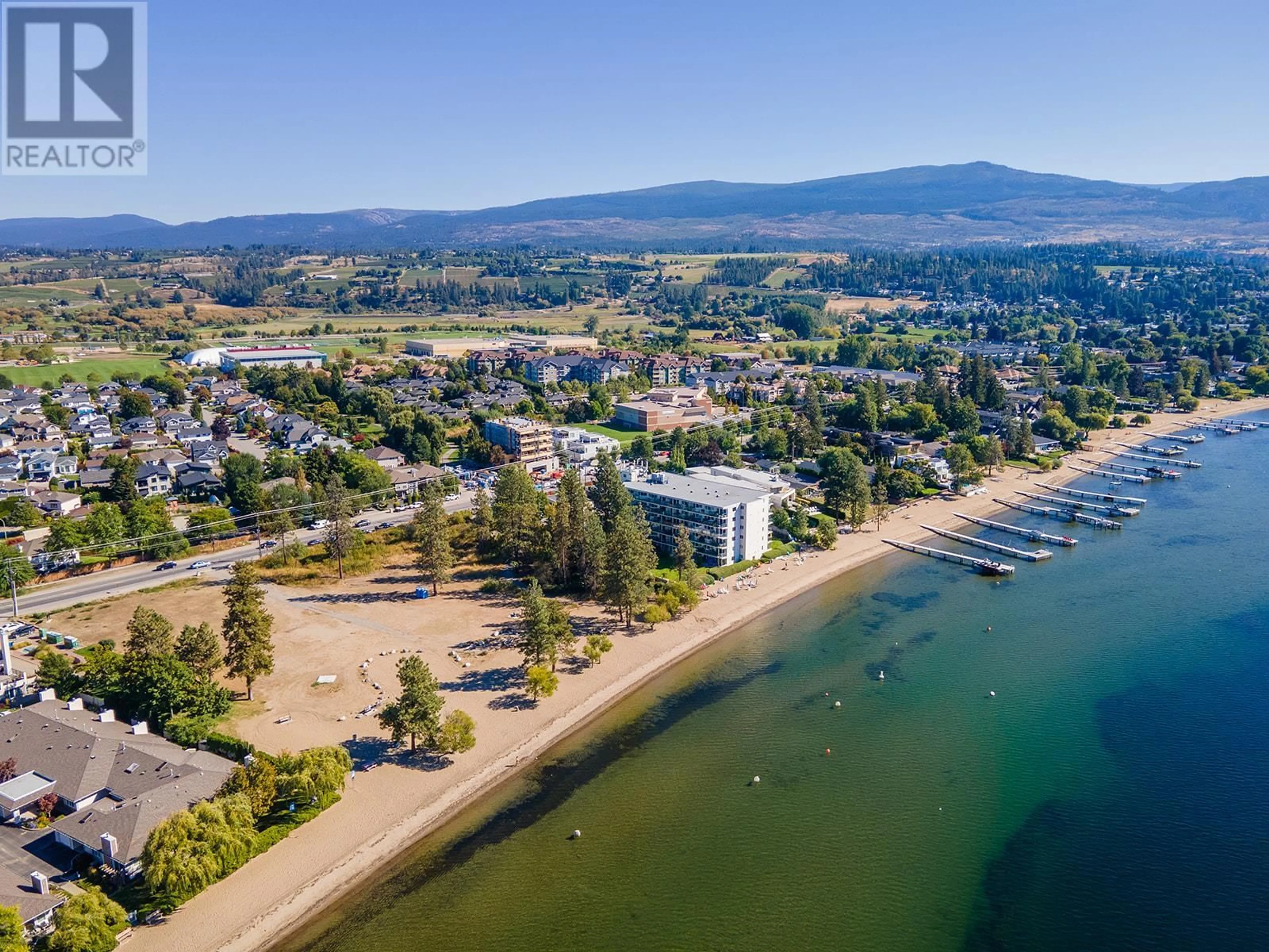 A pic from outside/outdoor area/front of a property/back of a property/a pic from drone, water/lake/river/ocean view for 4058 Lakeshore Road Unit# 506, Kelowna British Columbia V1W1V6