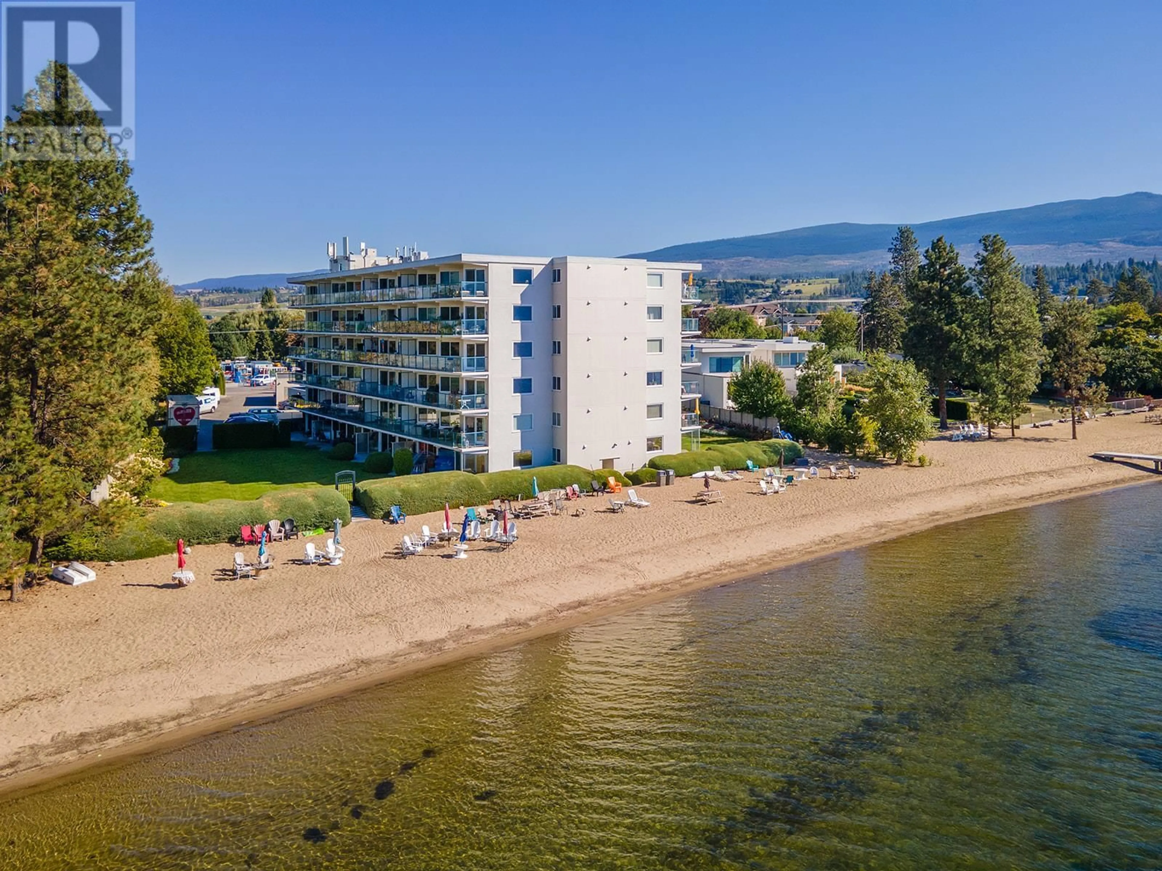 A pic from outside/outdoor area/front of a property/back of a property/a pic from drone, water/lake/river/ocean view for 4058 Lakeshore Road Unit# 506, Kelowna British Columbia V1W1V6