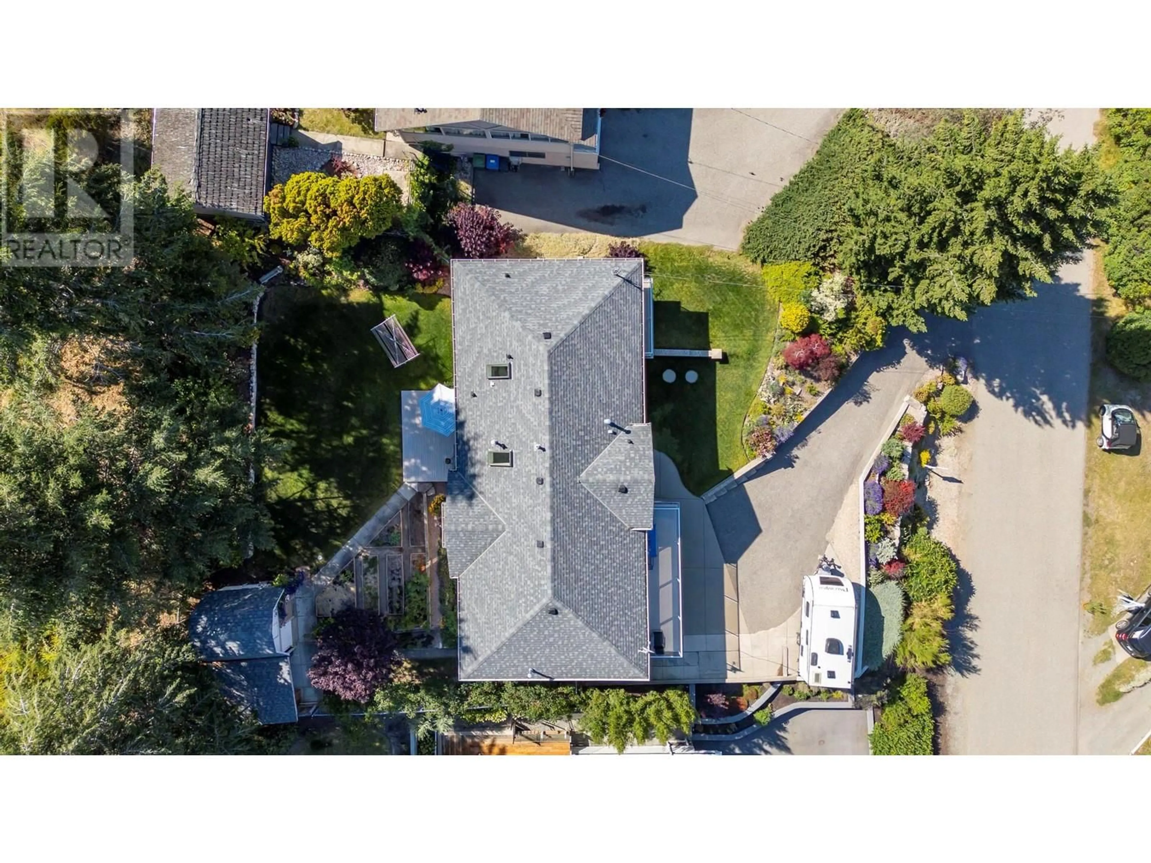 A pic from outside/outdoor area/front of a property/back of a property/a pic from drone, street for 17131 Coral Beach Road, Lake Country British Columbia V4V1B9