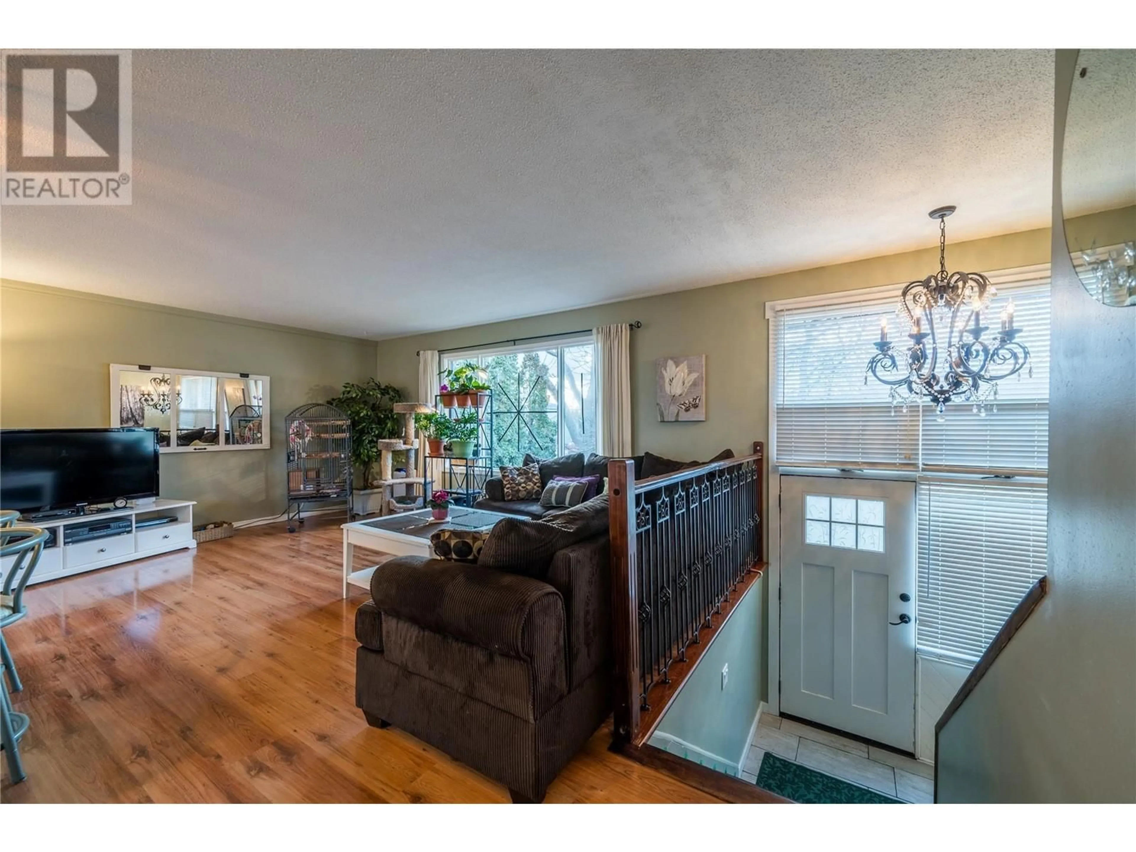 Living room with furniture, wood/laminate floor for 527 Pine Street, Chase British Columbia V0M1M0