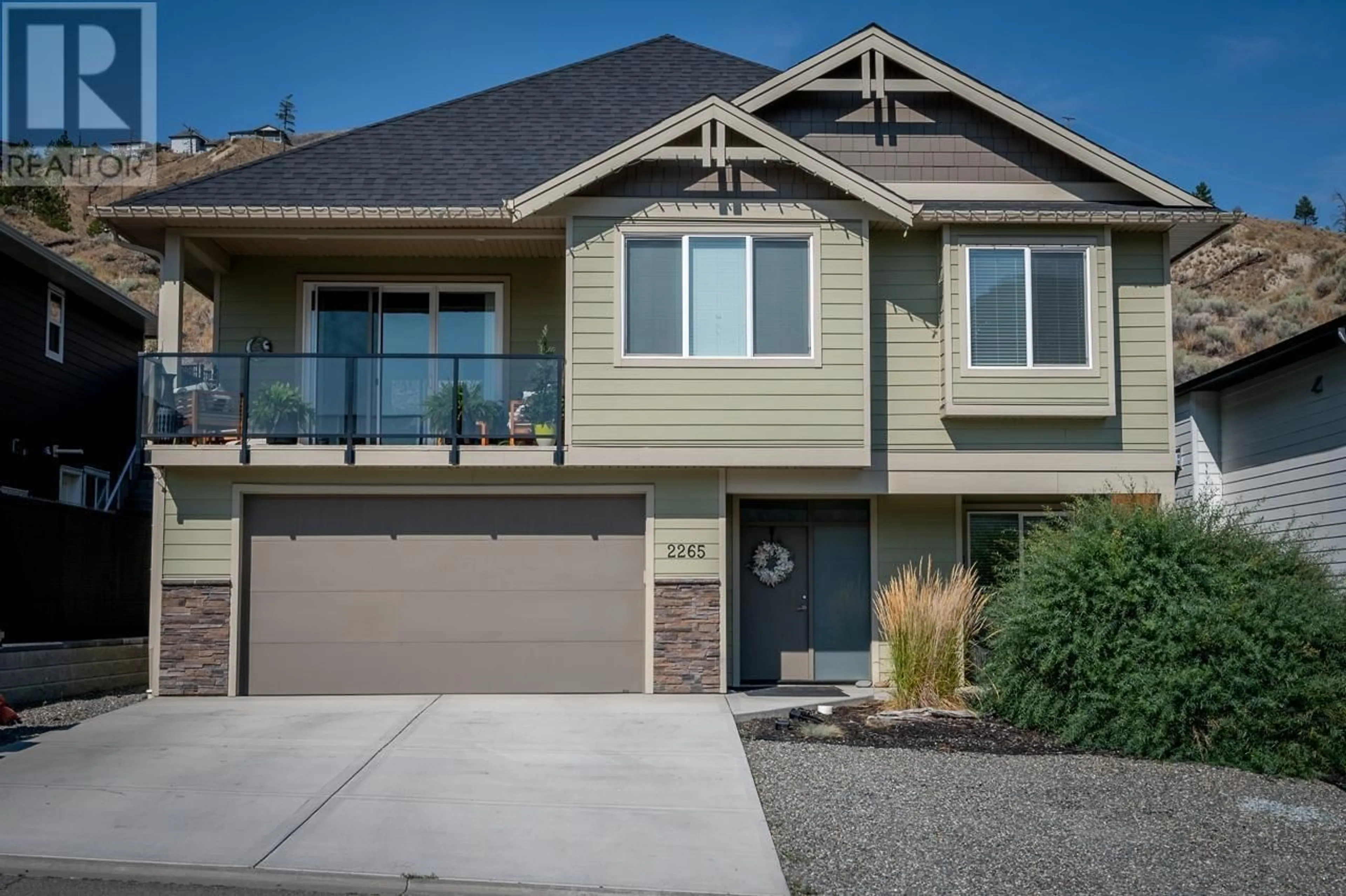 Home with vinyl exterior material, street for 2265 GRASSLANDS Boulevard, Kamloops British Columbia V2B0E3